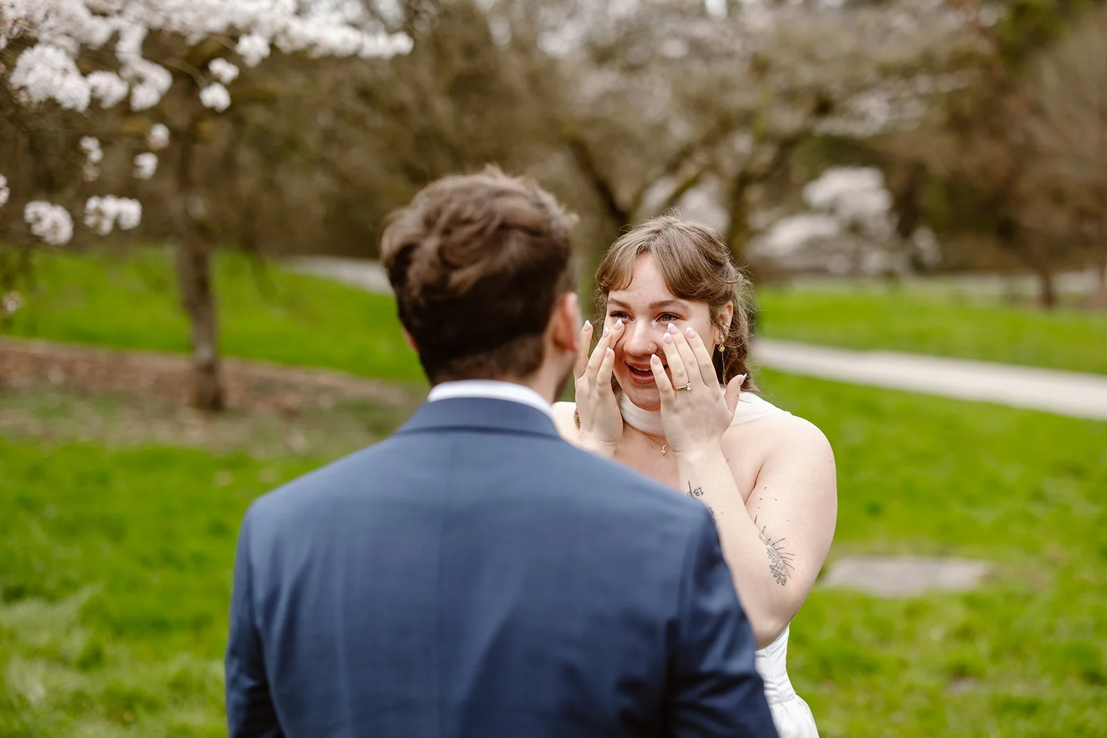 bride crying after her first look at the seattle arboretum