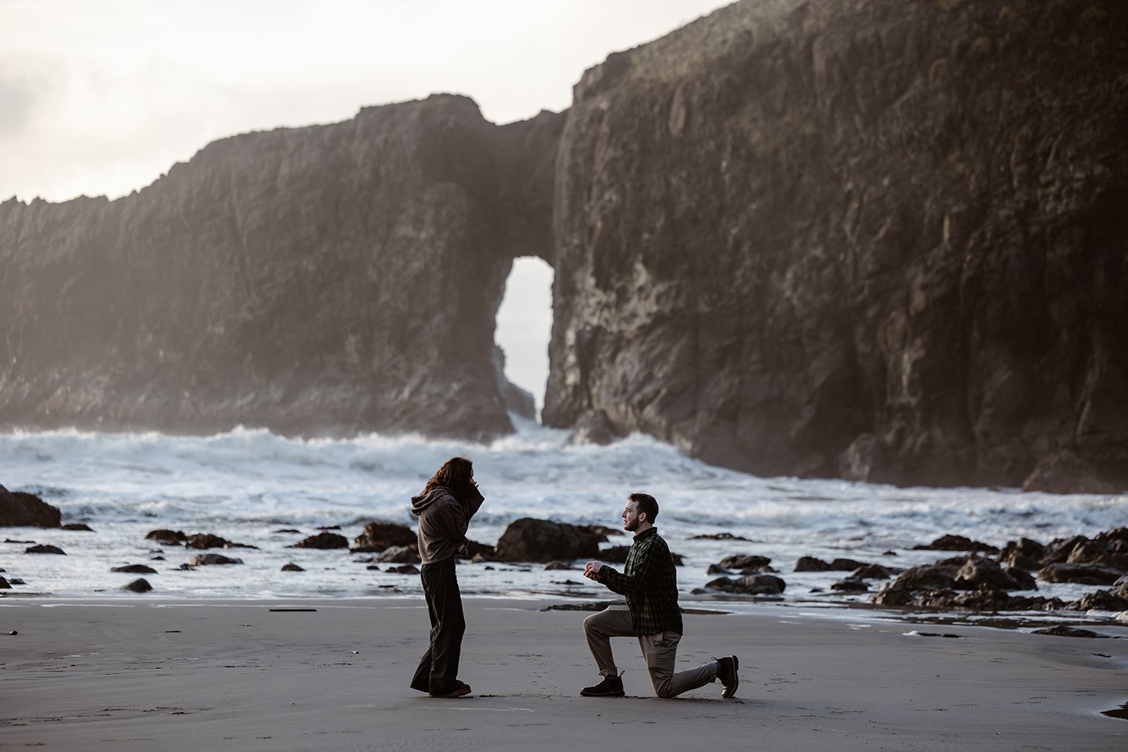 guy on one knee proposing at olympic national park
