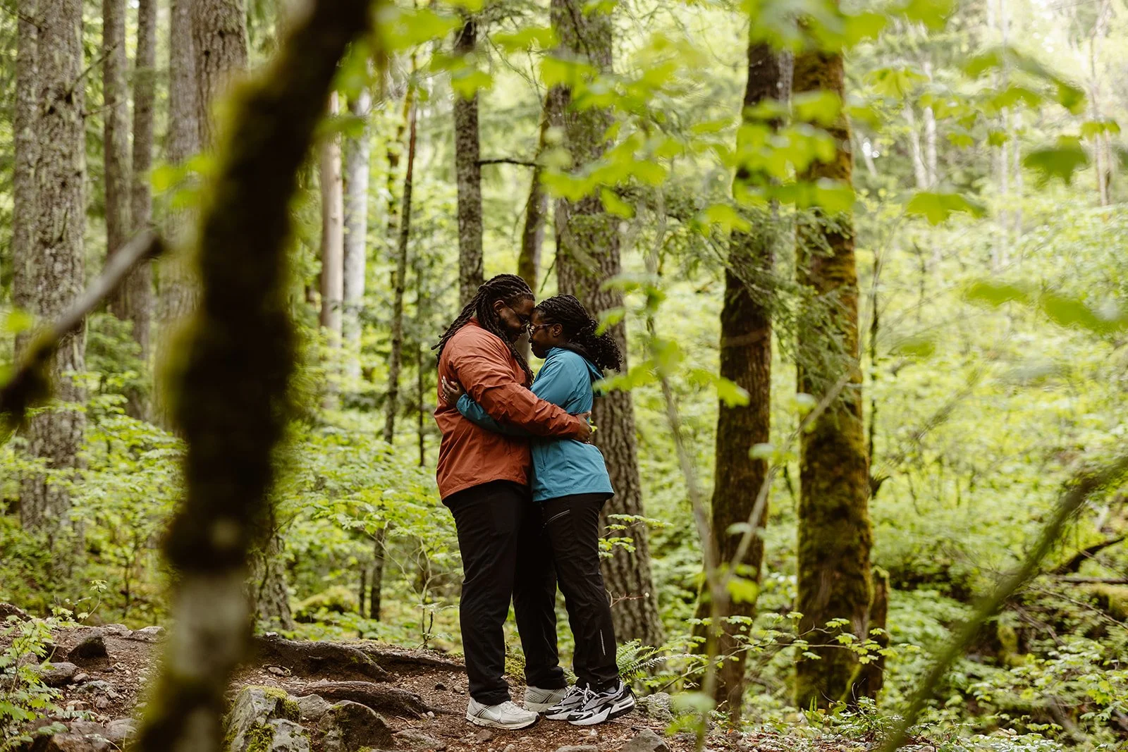 couple hugging after their surprise proposal in north cascades national park