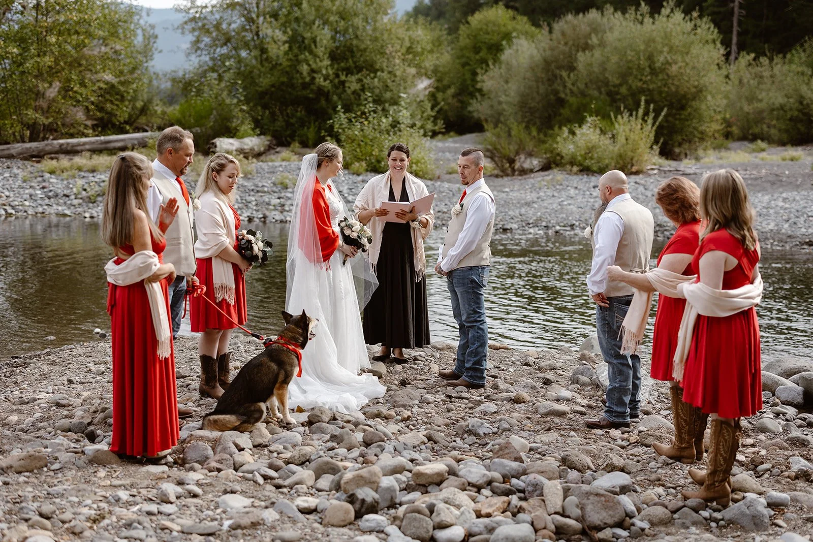 wedding couple reading their vows by the river for their wedding in packwood