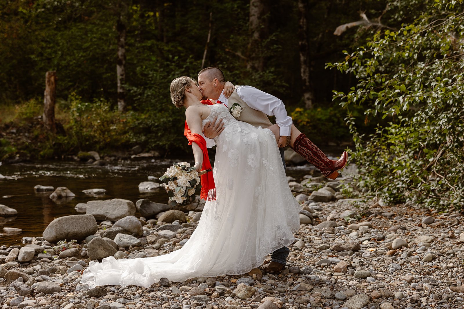 packwood wedding couple kissing by the river for their intimate wedding