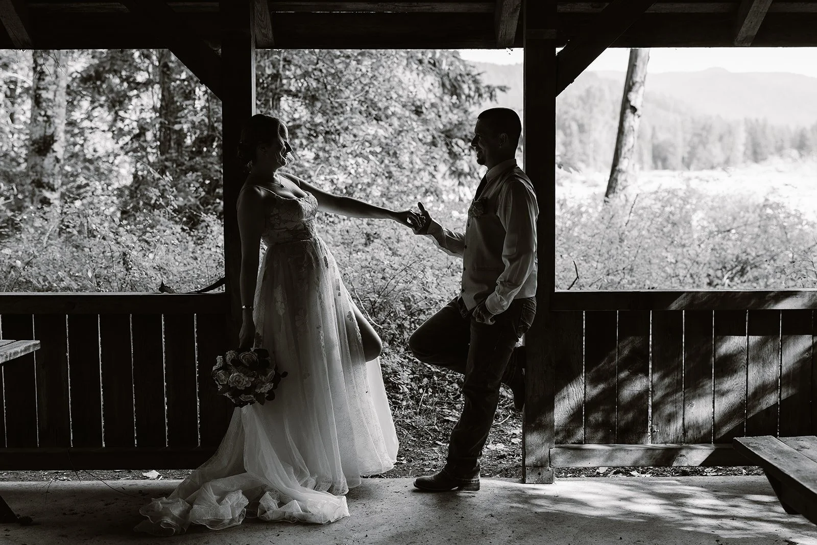 Packwood wedding couple smiling under a building for their wedding