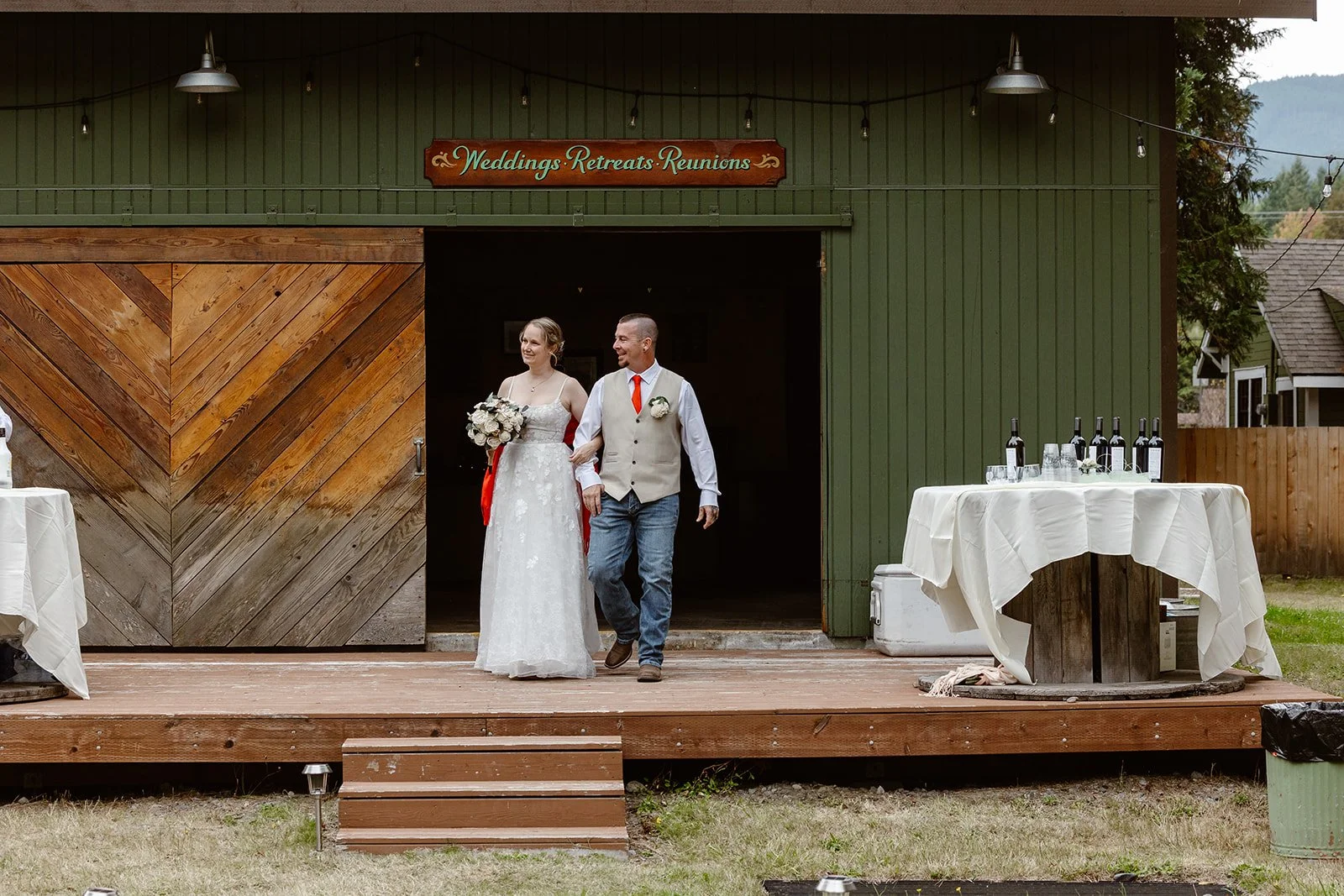 wedding couple walking out of the reception for their wedding in packwood