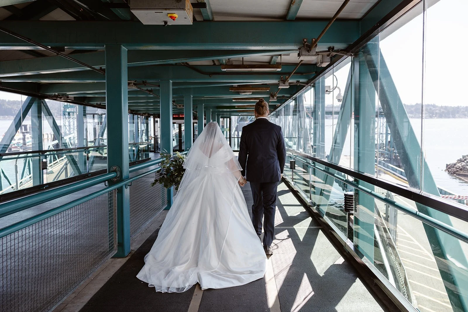 Seattle wedding couple walking onto the ferry for their wedding in Seattle
