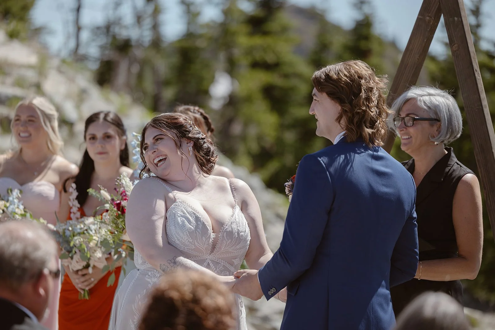 wedding couple smiling at each other for their mountain wedding