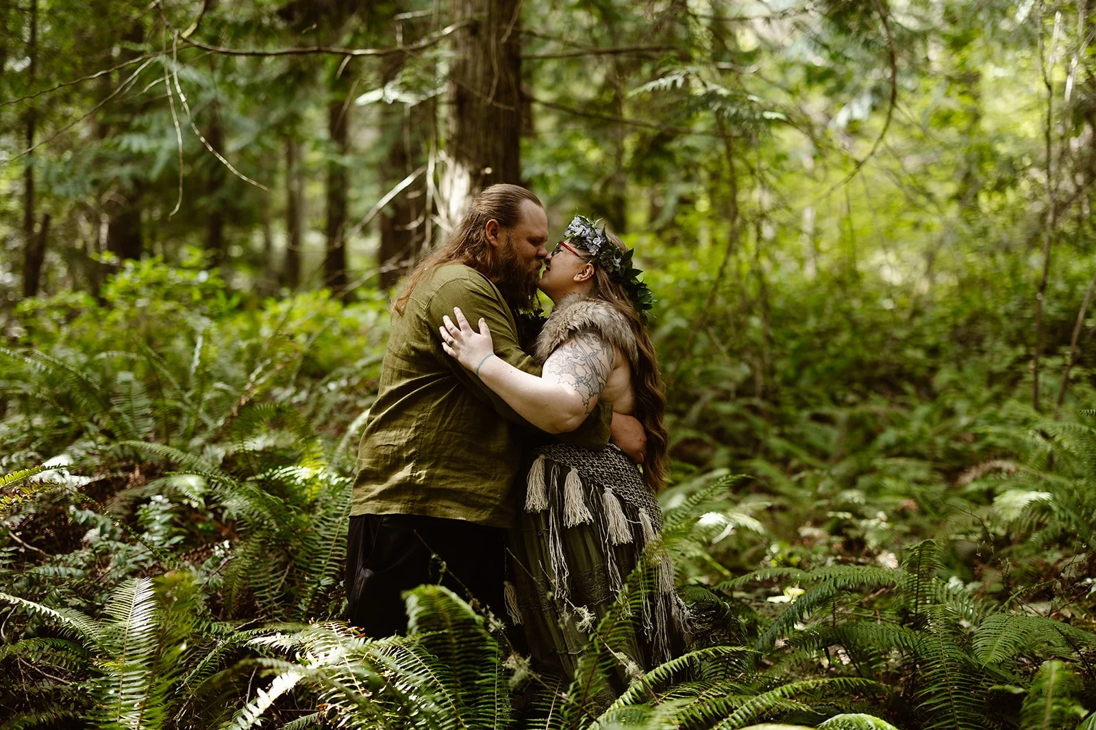 couple smiling in the fern for their washington wedding