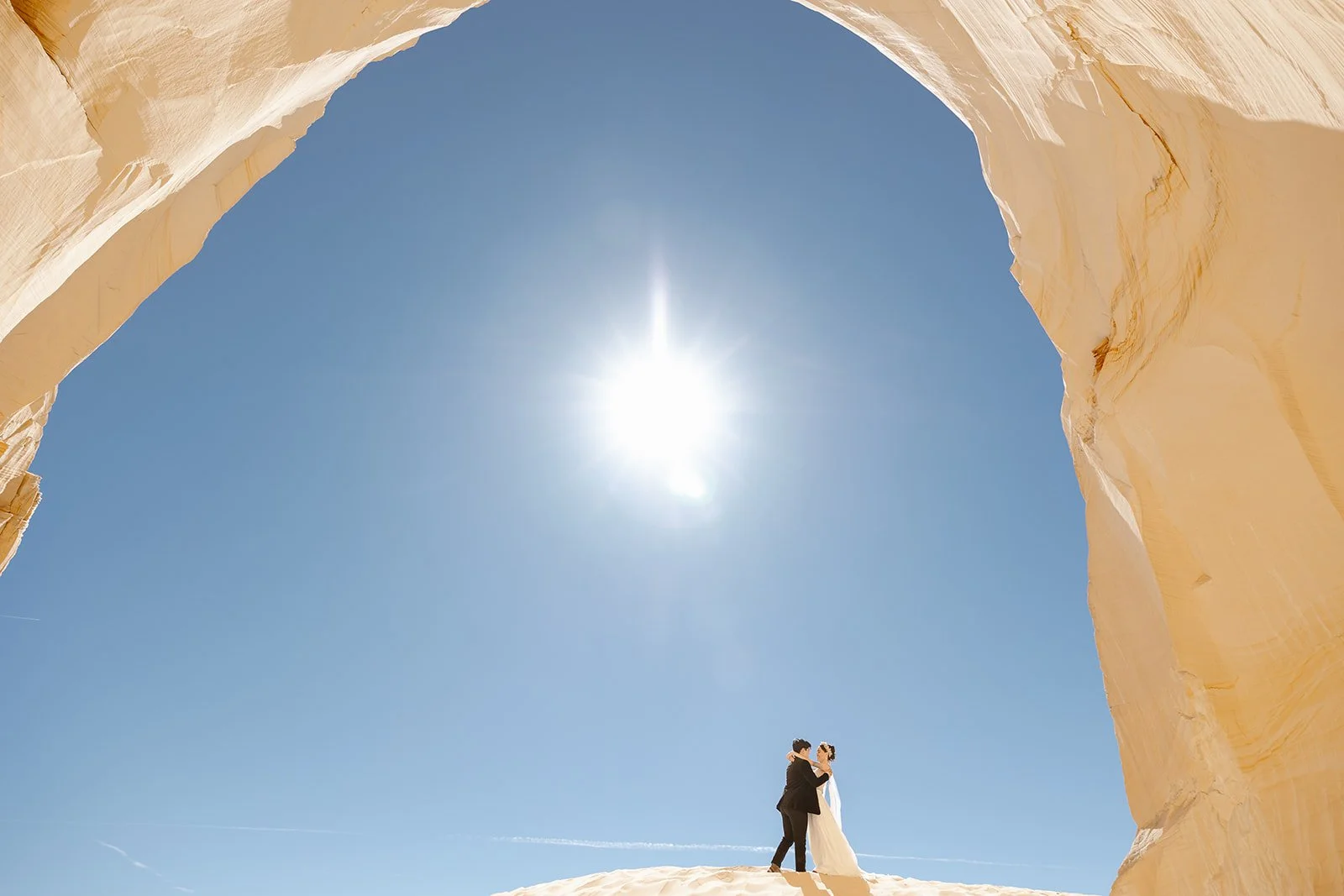 Arizona couple standing under an arch for their elopement in Page Arizona