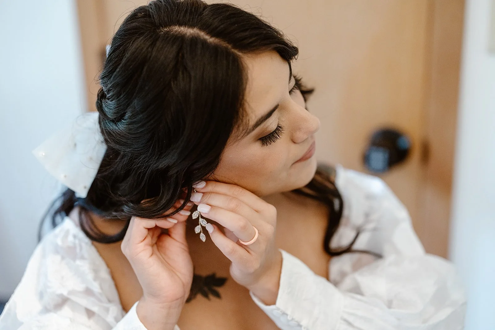 bride putting on her earring for her north cascades elopement