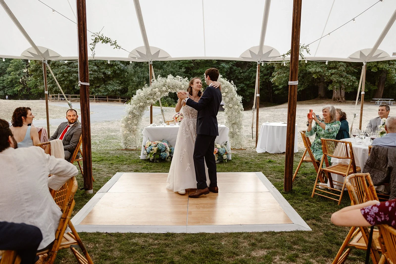 couple dancing on the stage for their micro wedding in st edwards state park in washington