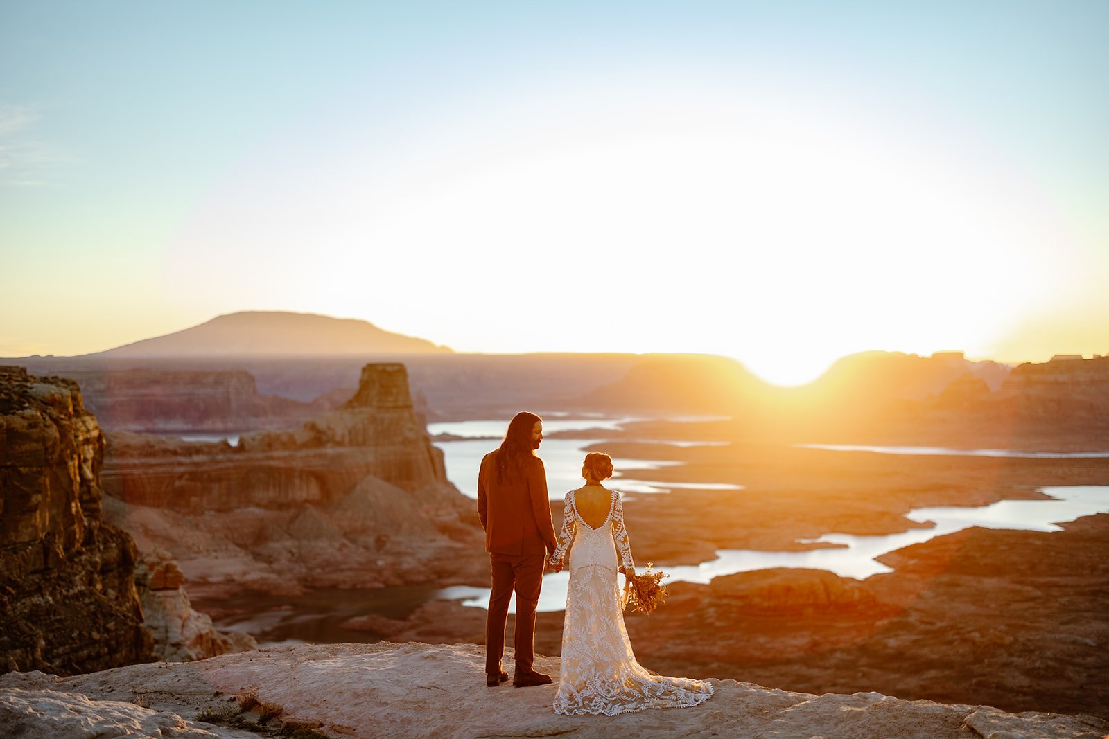Arizona elopement couple looking at each other during sunrise