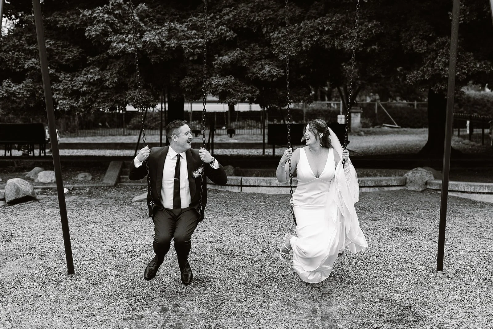 washington couple playing in the swings for their wedding