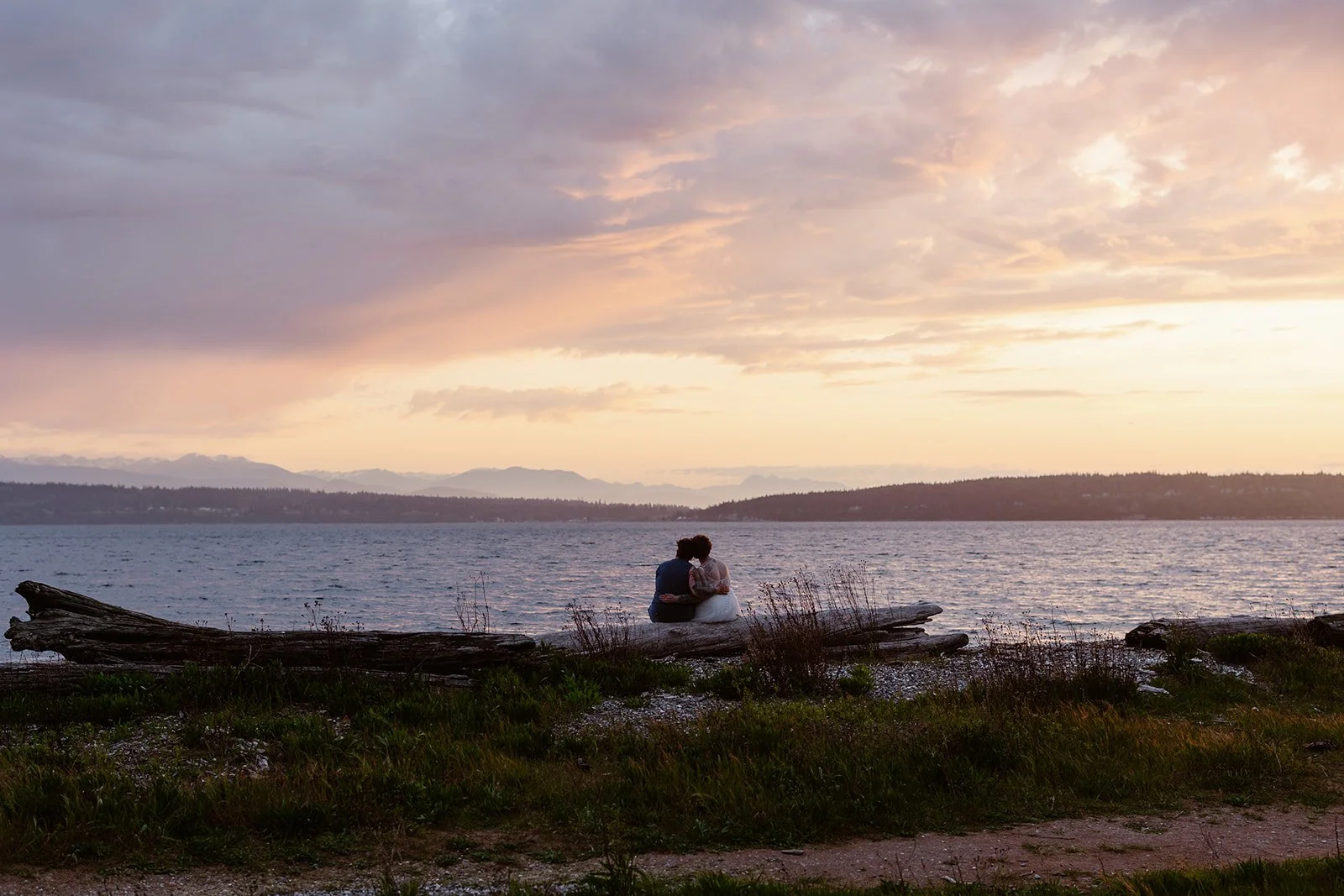 elopement couple sitting watching the sunset for their wa state elopement