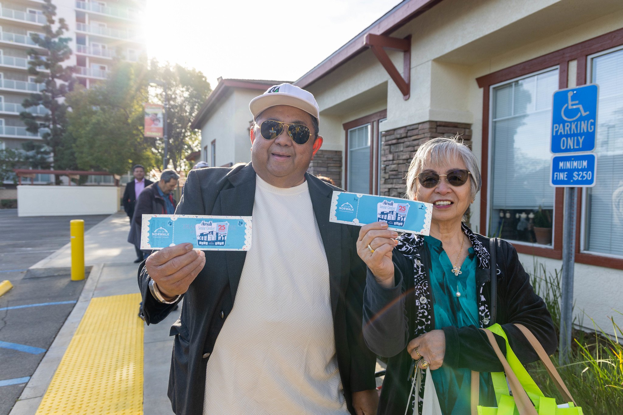 Seniors with their event ticket in hand