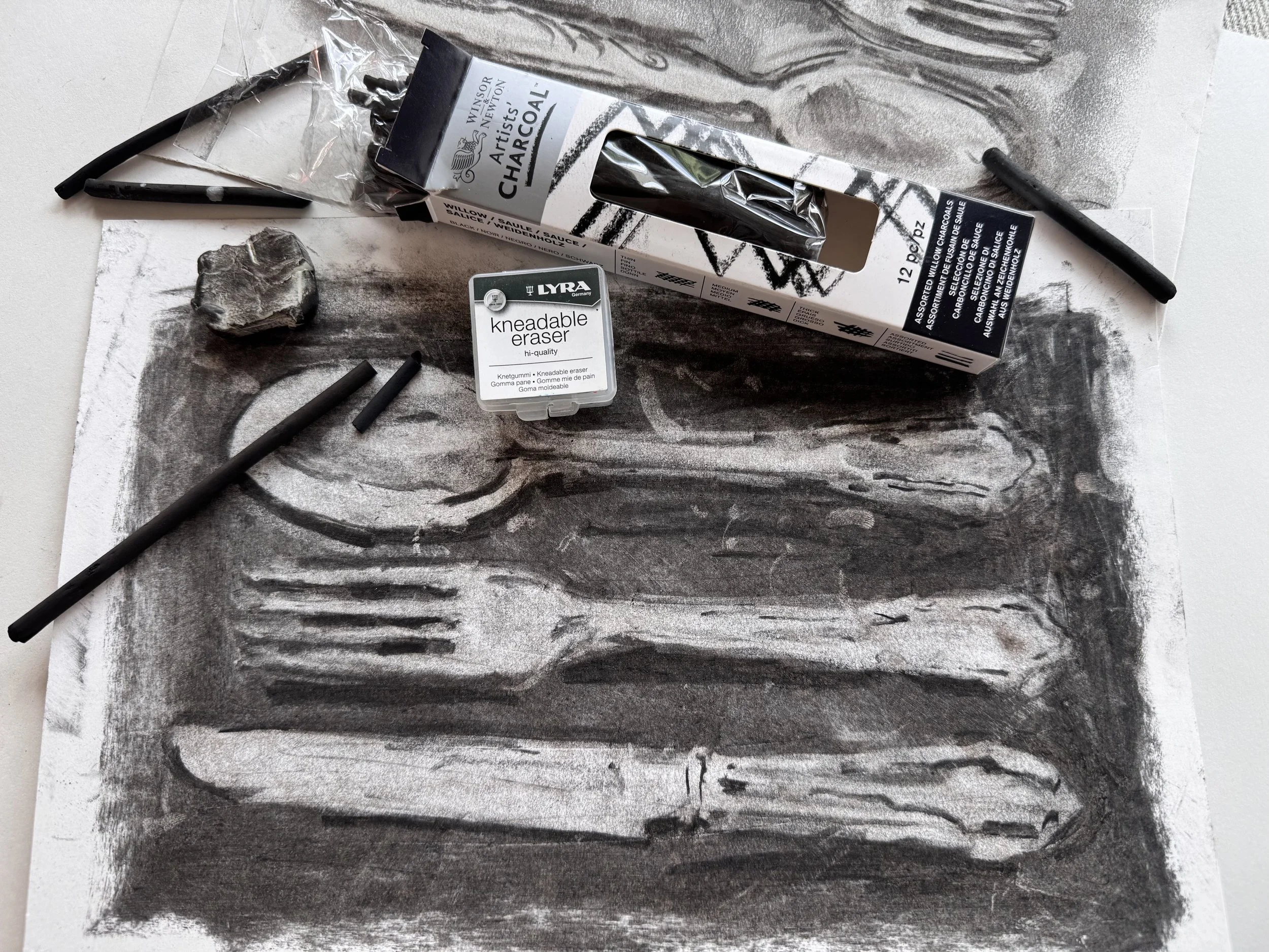 Drawing with charcoal and using putty rubber to erase