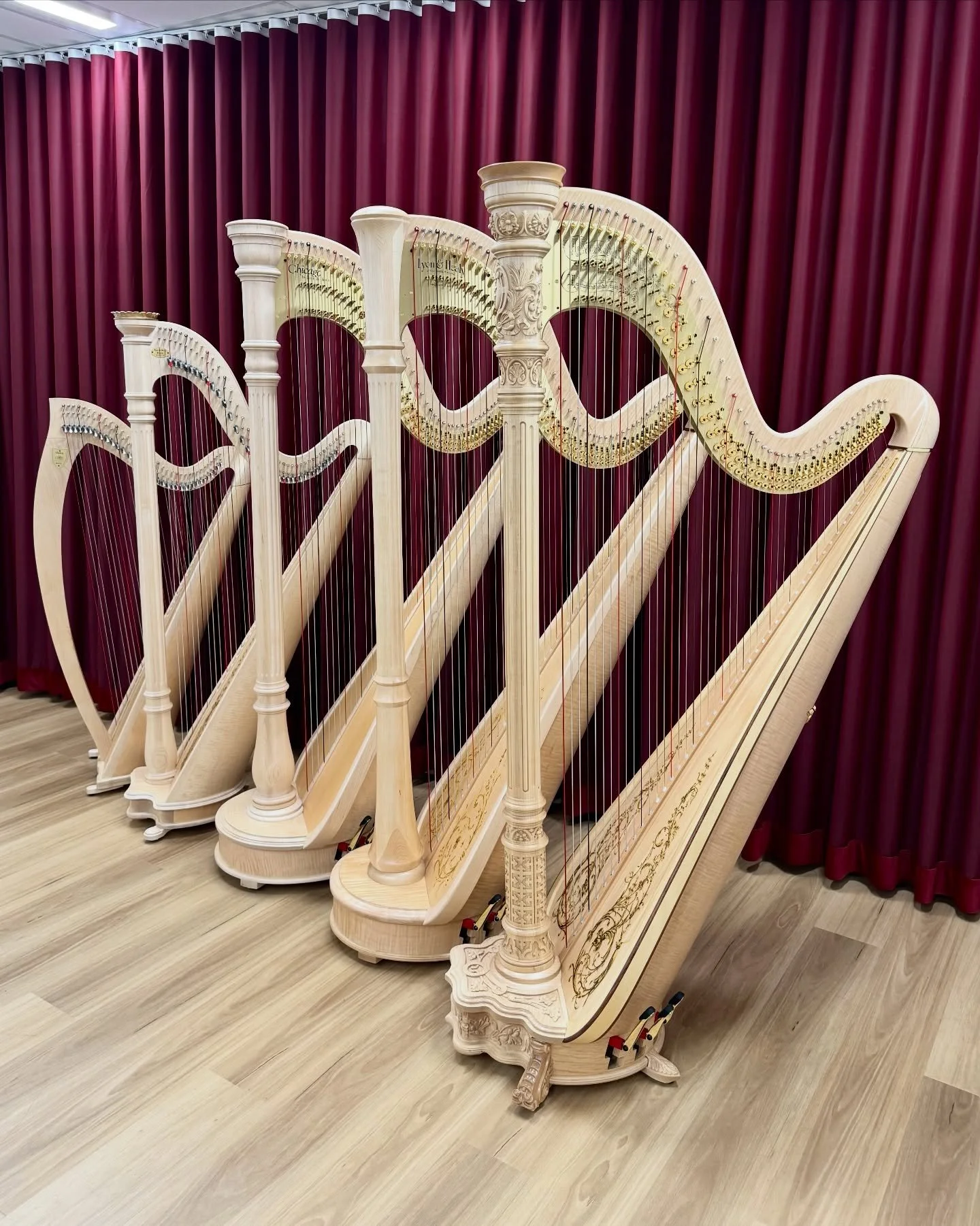Lyon &amp; Healy Harps &ndash; Ogden, Prelude, Chicago, Style 85, Style 23

From first instruments through to concert grand pedal harps &mdash; used by students, teachers, and professionals in orchestras and on stage.

In this photo are harps in natu