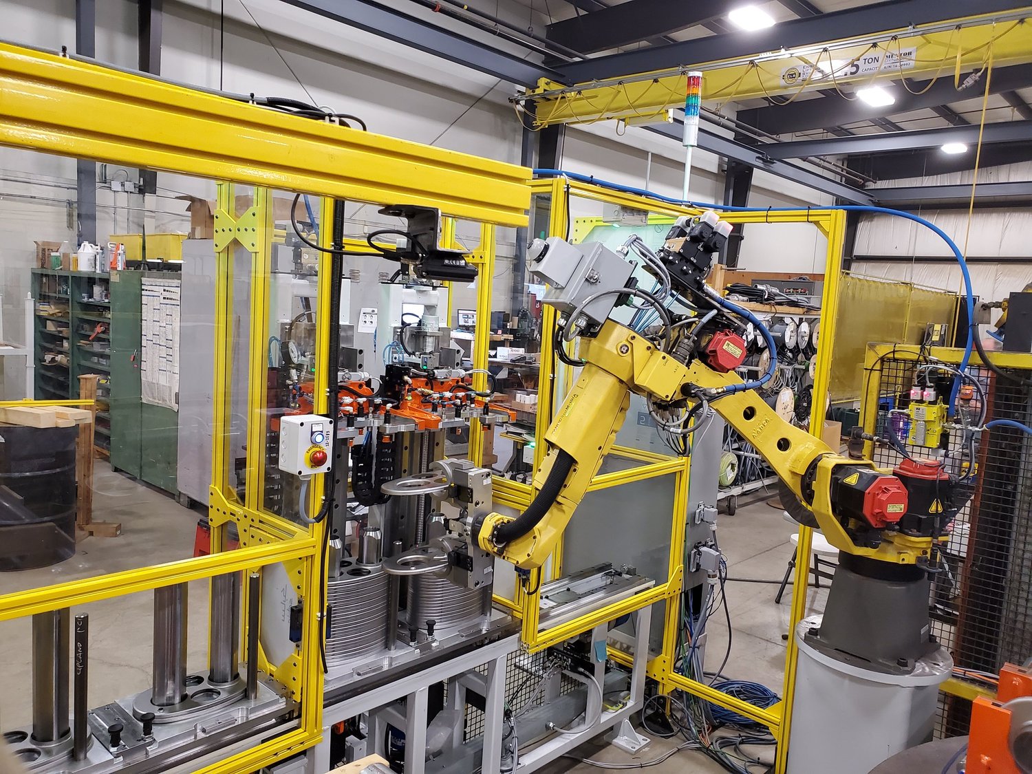 Industrial robotic automation cell for OEM machine manufacturing application
