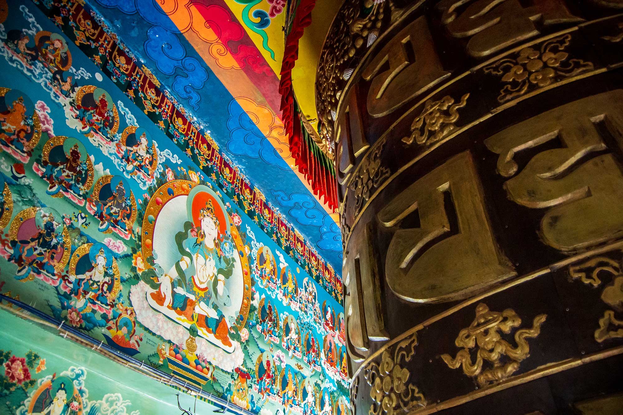 Prayer wheel house of the Buddha of Compassion at the Kopan Monastery, a Tibetan Buddhist monastery near Boudhanath on the outskirts of Kathmandu, Nepal.