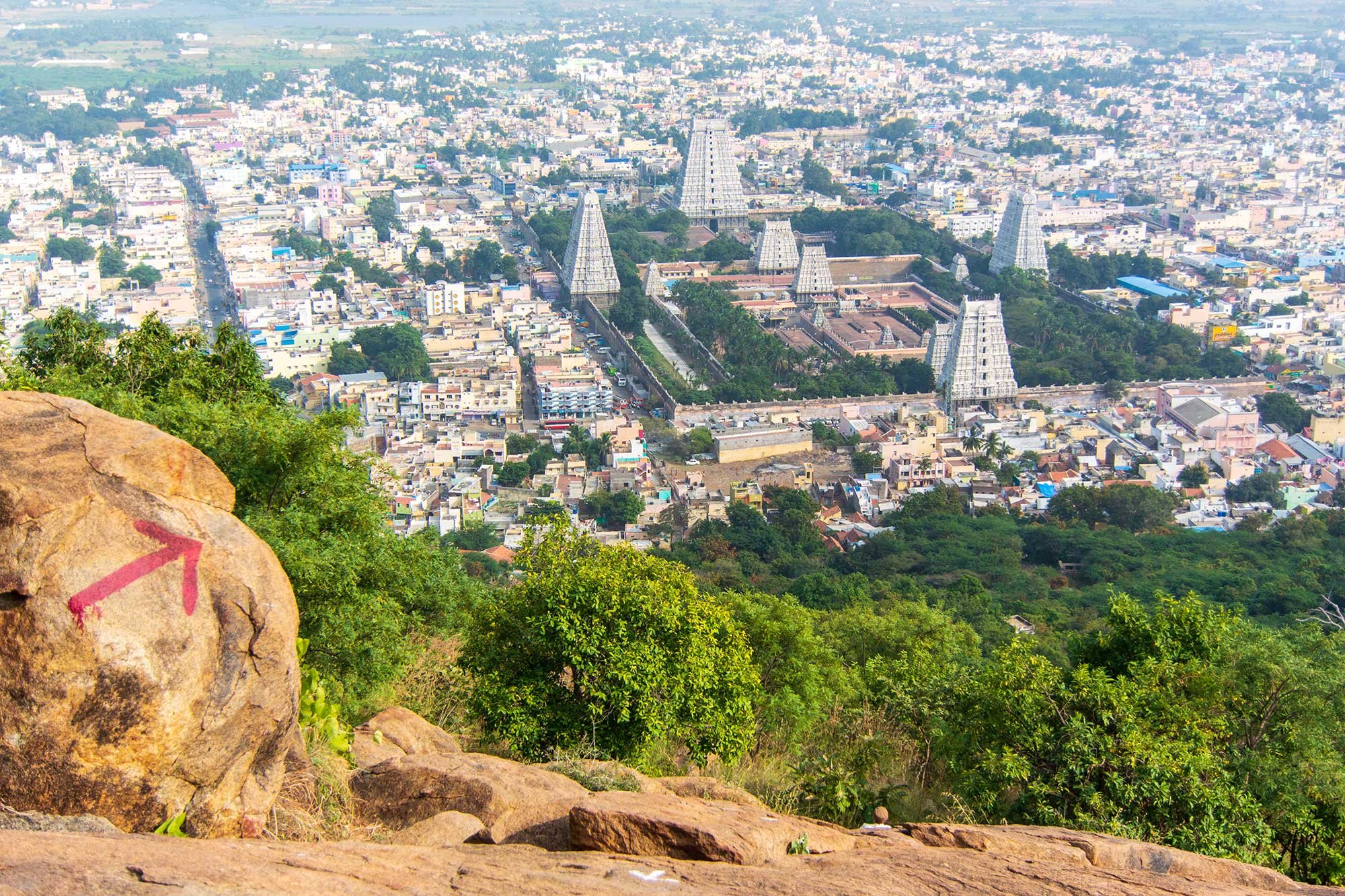 View of Annamalaiyar Temple from the hike up Arunachala Mountain in Tiruvannamalai, India. Arunachala is one of the five main Shaiva holy places in South India. Ramana Maharshi said that Arunachala is Lord Shiva himself.