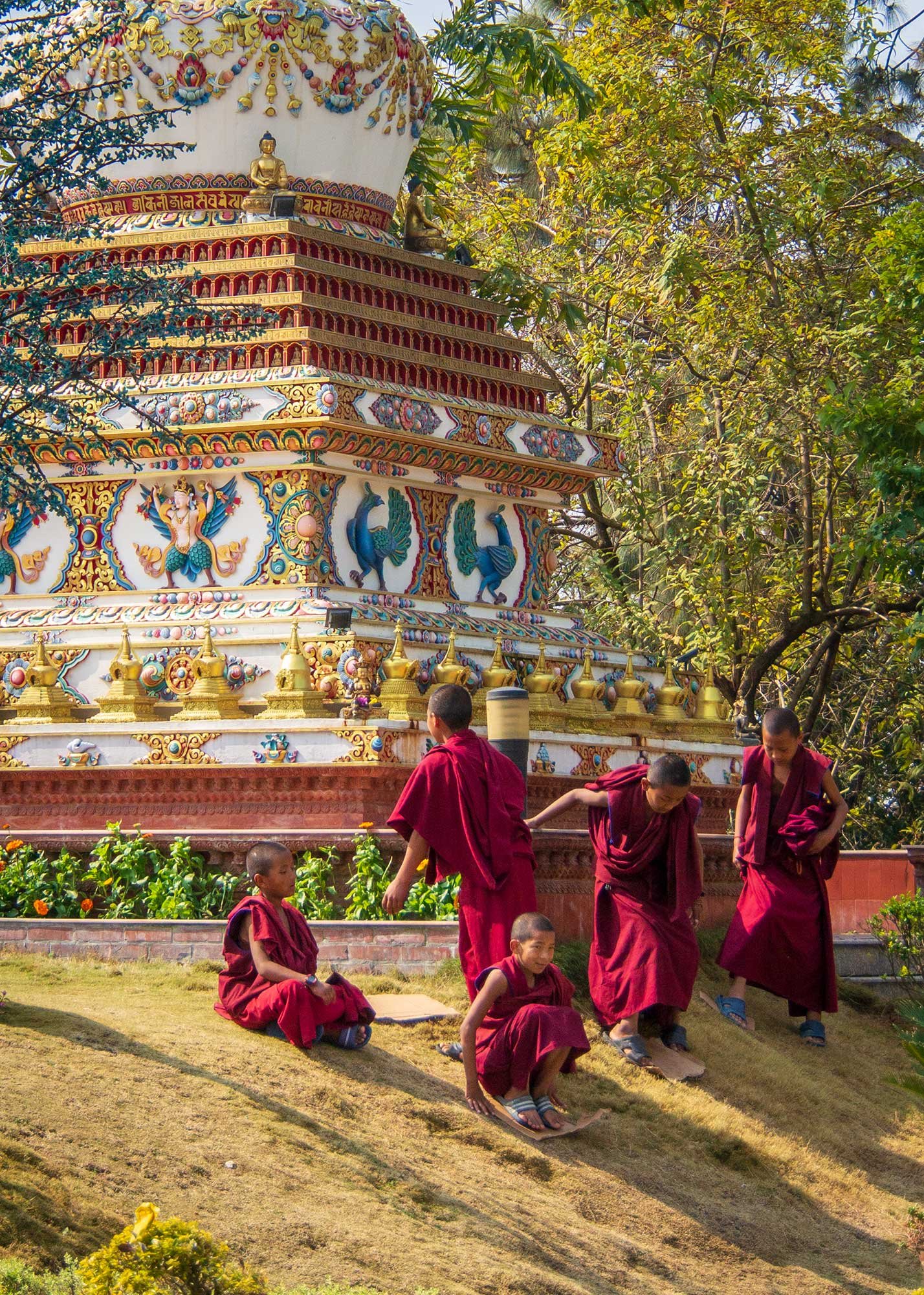 Young monks playing at Kopan Monastery, Kathmandu, Nepal. Proving that a cardboard box is a universally loved toy.