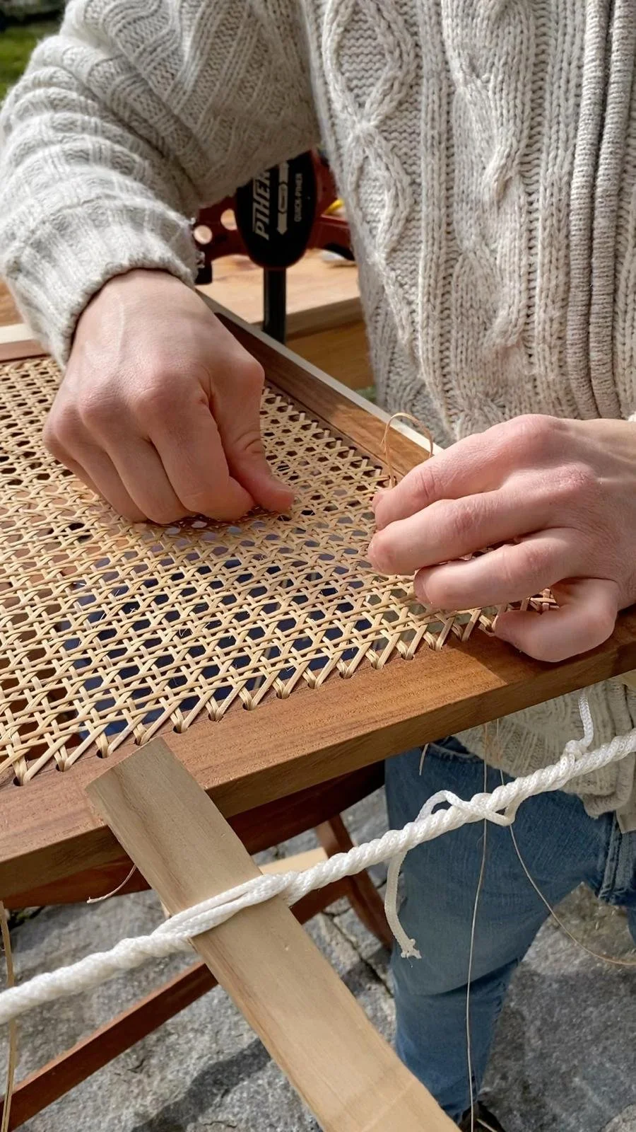 The process of weaving the rattan seat by hand