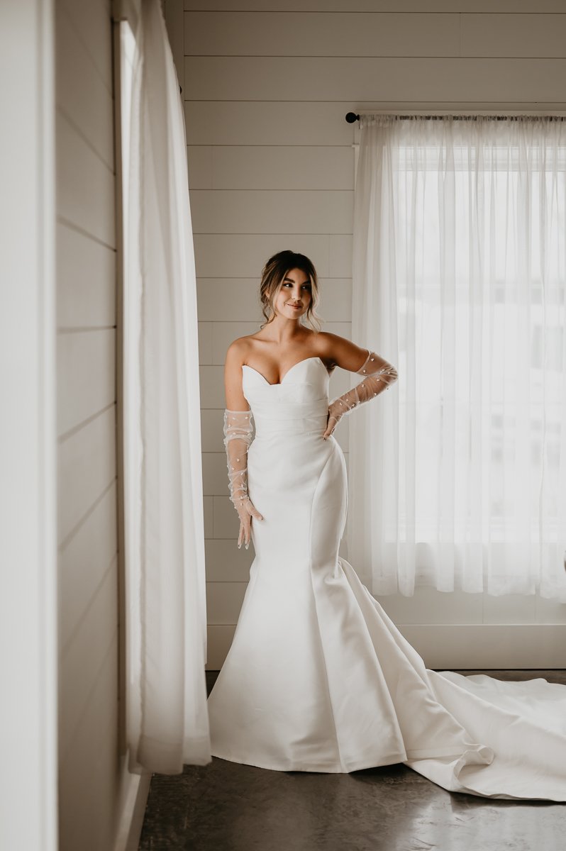 This photo, captured by Julia Brown Photo, features the bride at Crimson Lane, surrounded by gorgeous natural lighting.