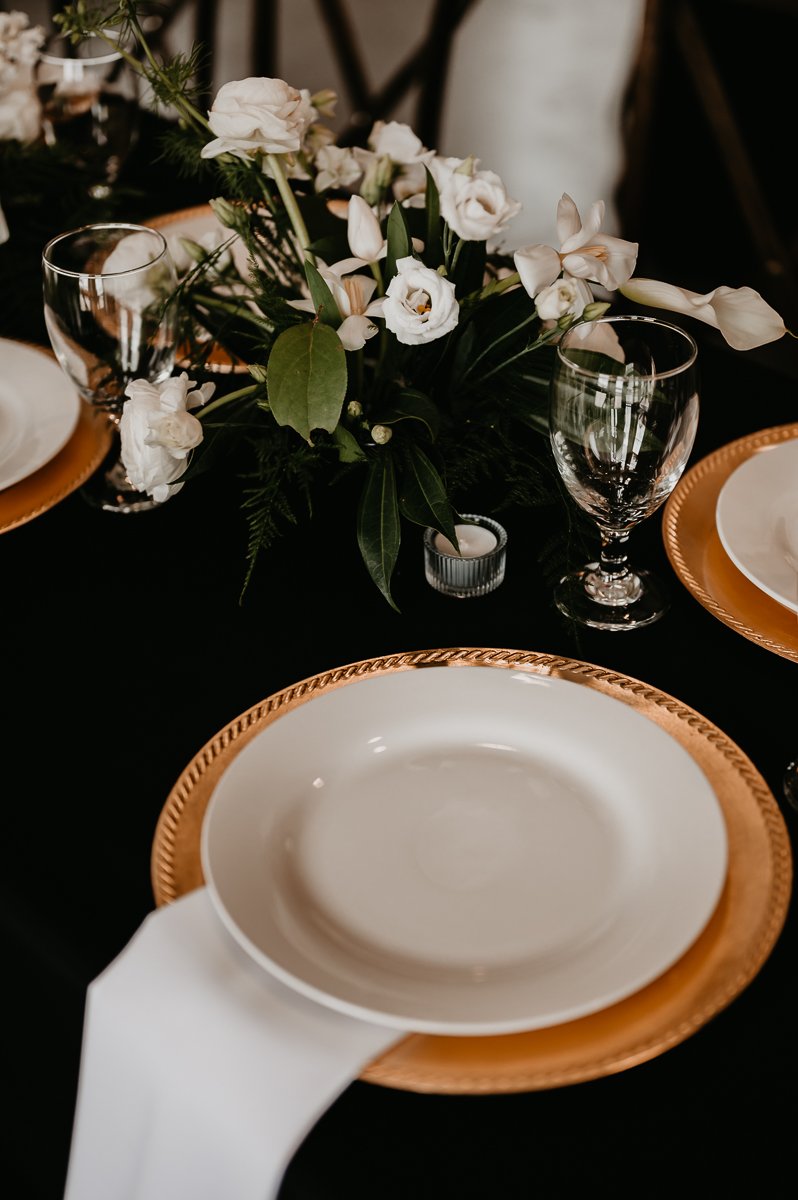 Sophisticated Tablescape Design at Crimson Lane Wedding Venue with Black Linens and Floral Centerpiece | Photo by Julia Brown Photo
