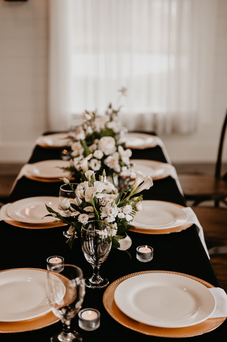  Sophisticated Tablescape Design at Crimson Lane Wedding Venue with Black Linens and Floral Centerpiece | Photo by Julia Brown Photo