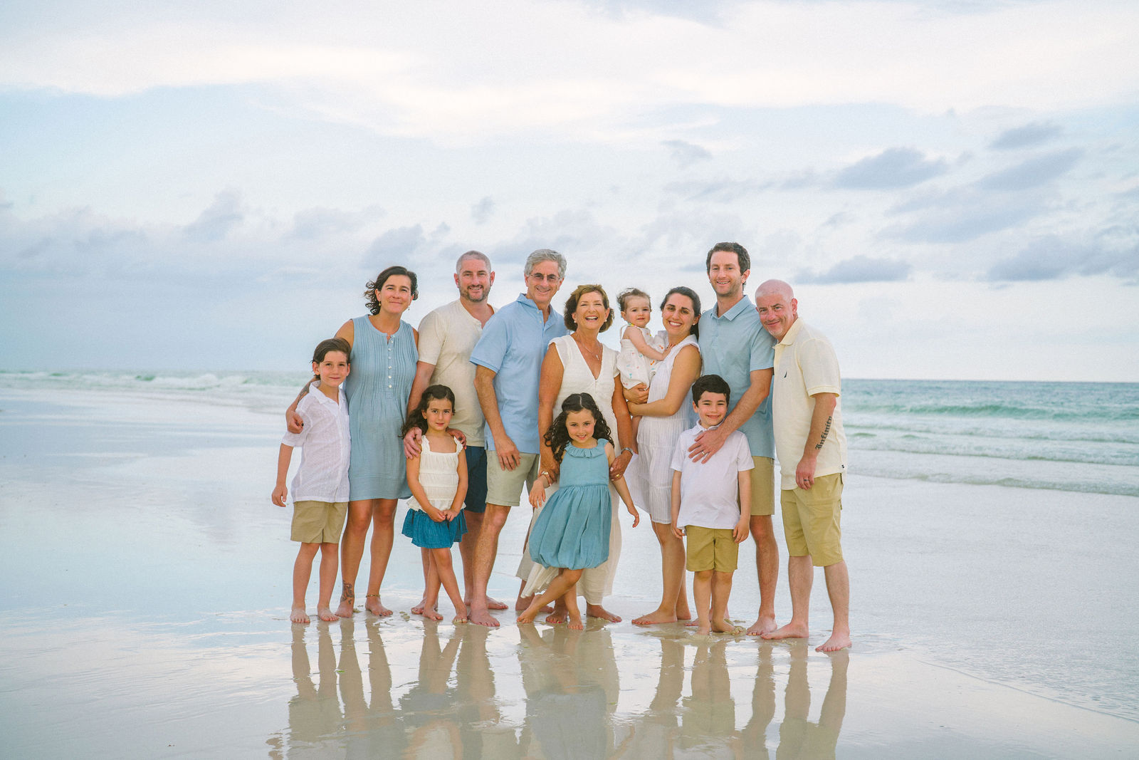 Family group portrait on the beach.
