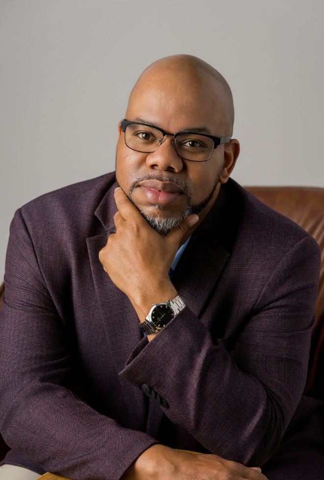 Man in glasses wearing a blazer