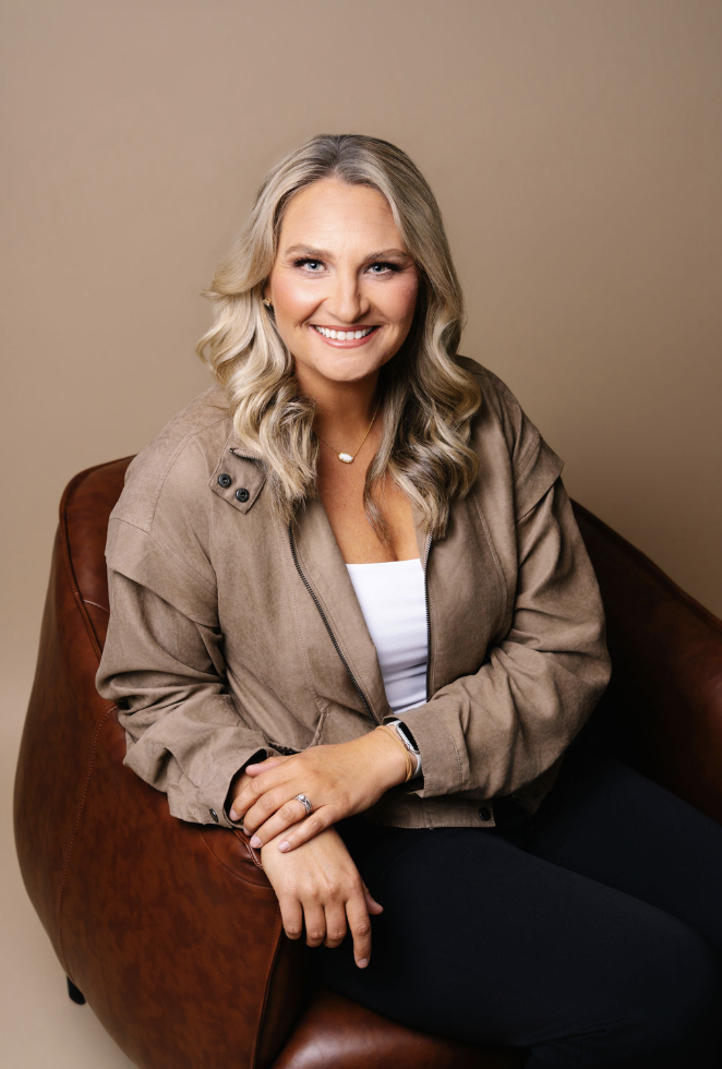 Smiling woman seated in a leather chairSmiling woman seated in a leather chair