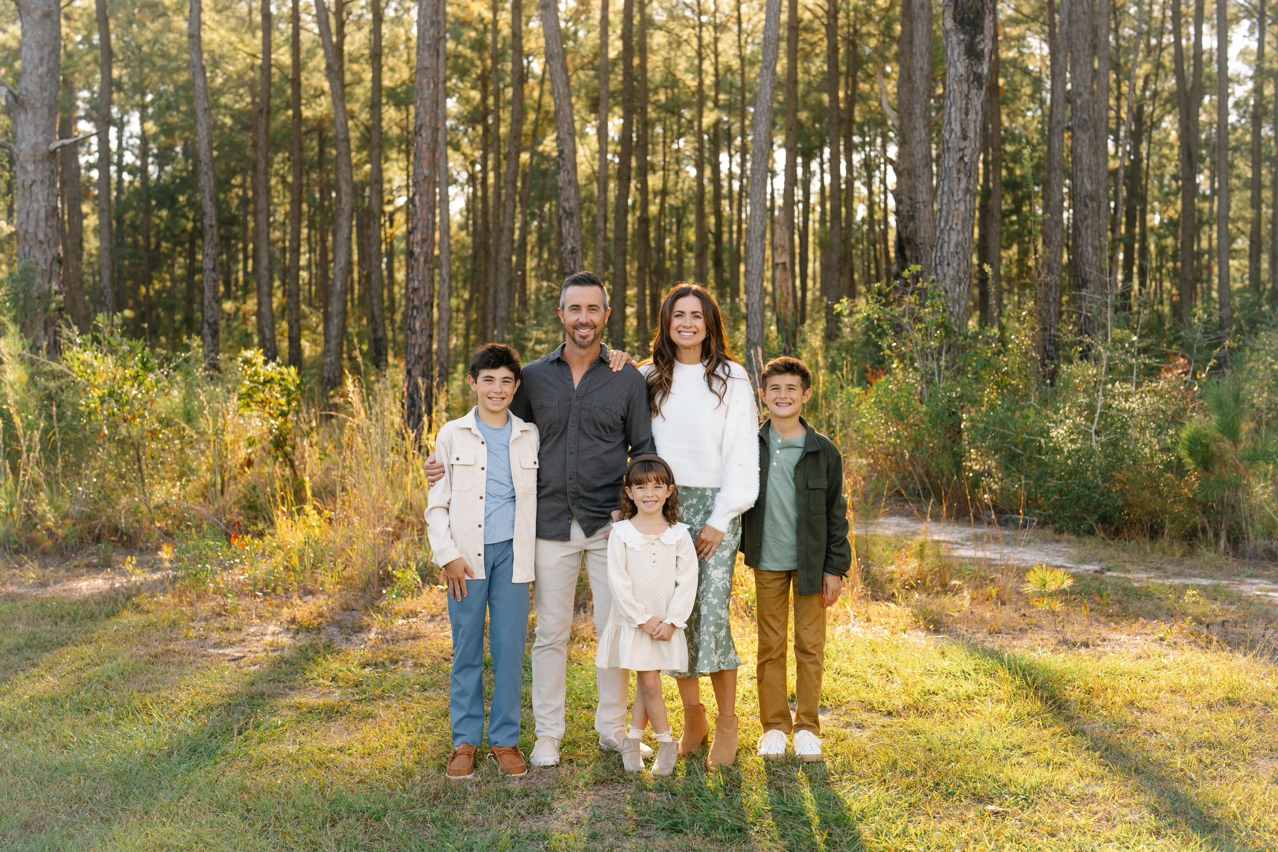 Freeport family photography session with parents and children in a forest