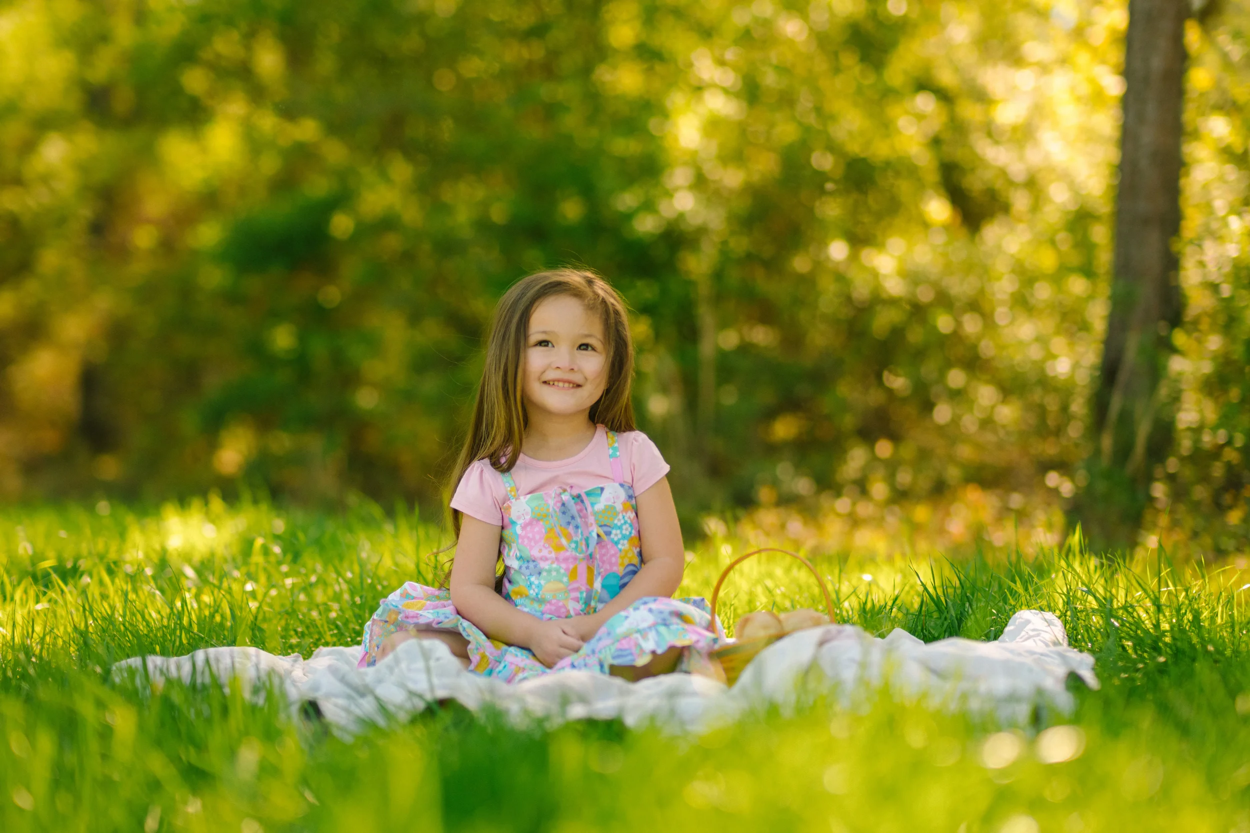 Freeport family photography session featuring a young girl sitting outdoors