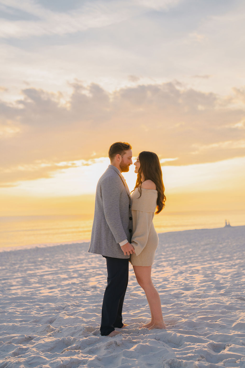 Couple embracing at beach sunset