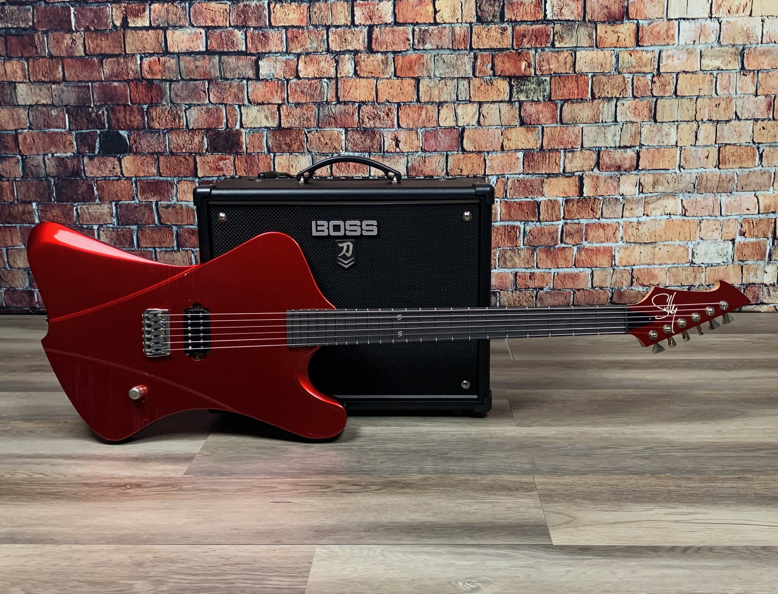 SullyGuitars Raven Baritone w Boss Katana.jpeg