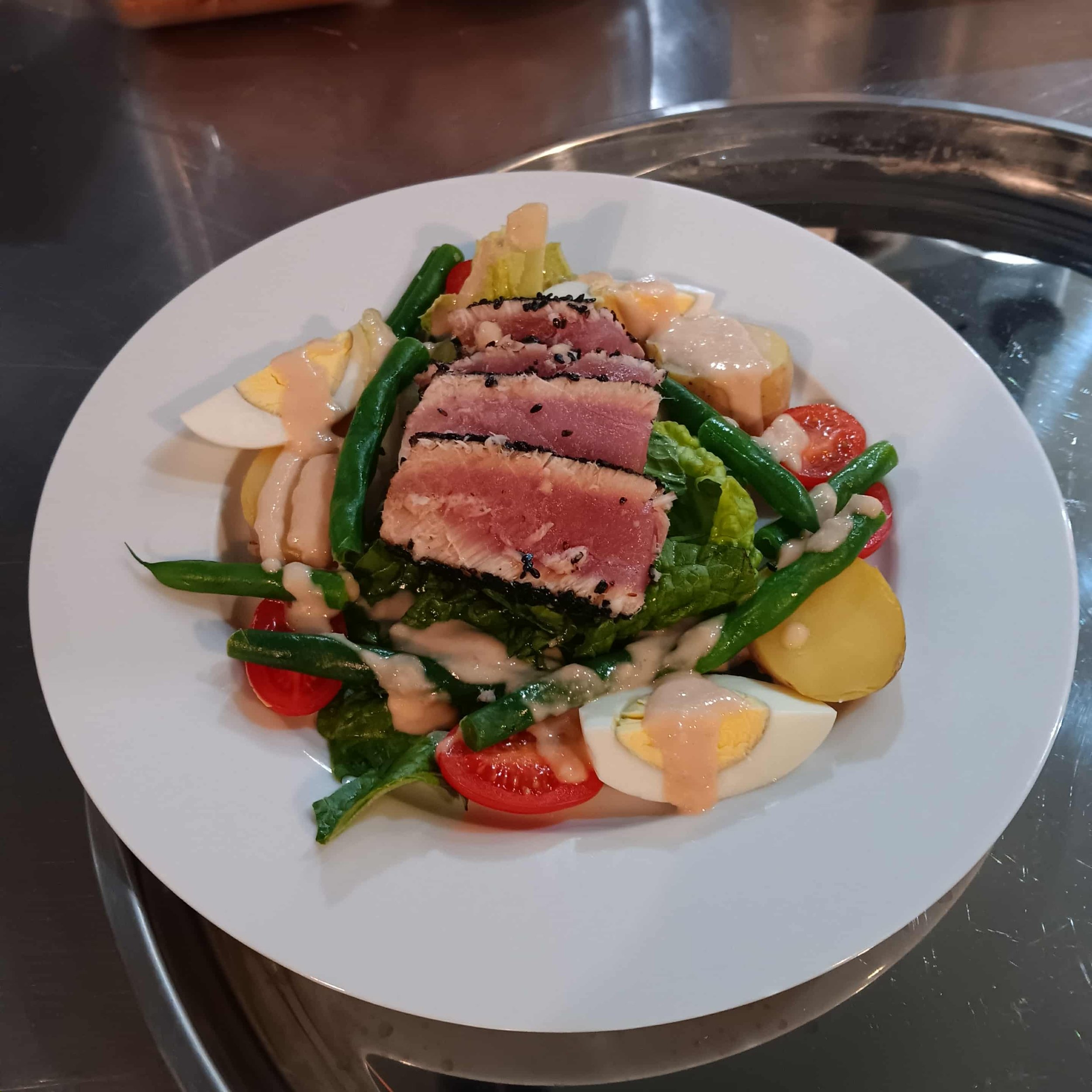 Private Dinner Salad Course: A presentation of ahi tuna, fingerling potatoes, haricots verts, and egg with Dijon-shallot vinaigrette. 