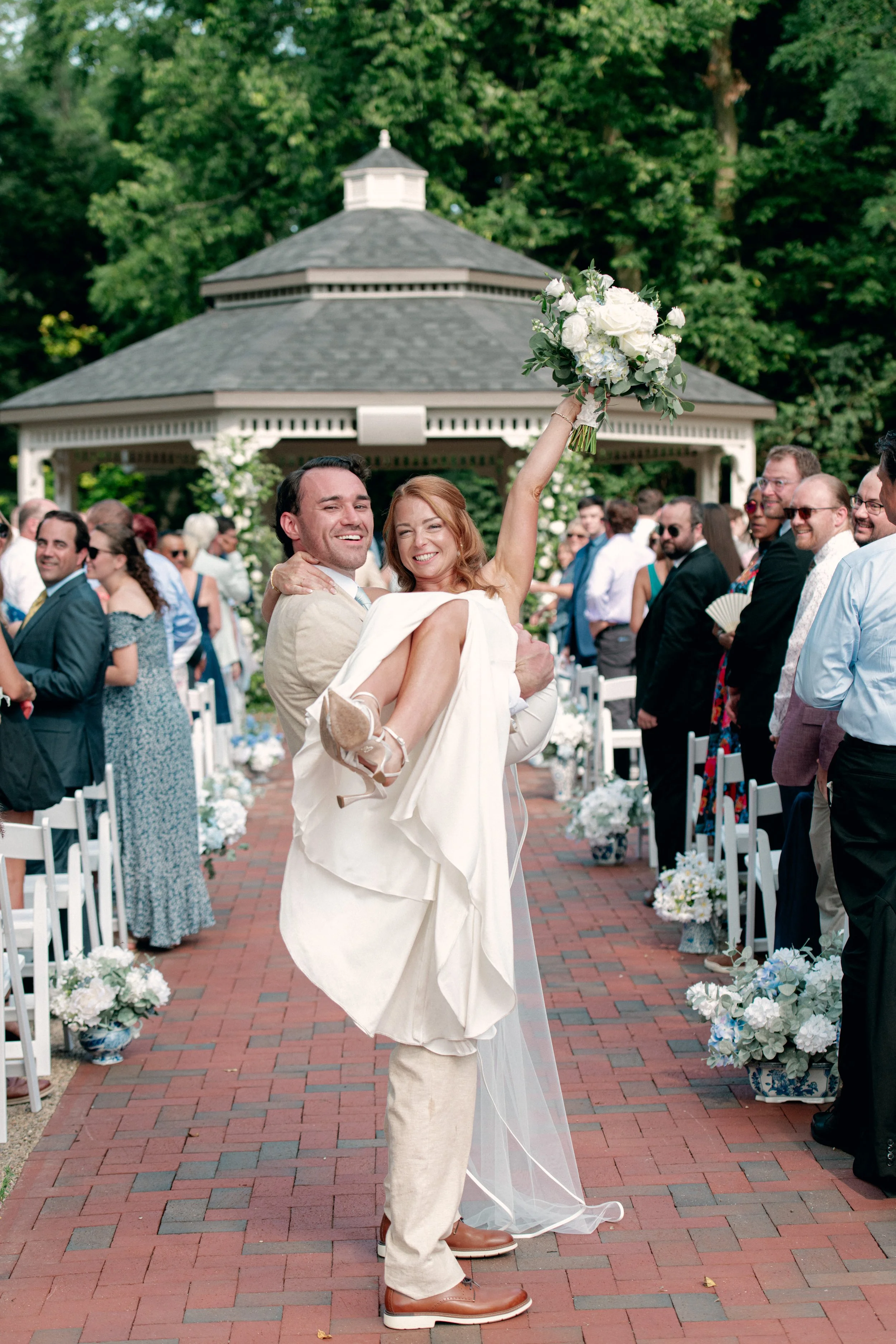 Wedding ceremony photo at the newly renovated reception space at Benham's Grove in Dayton, Ohio.