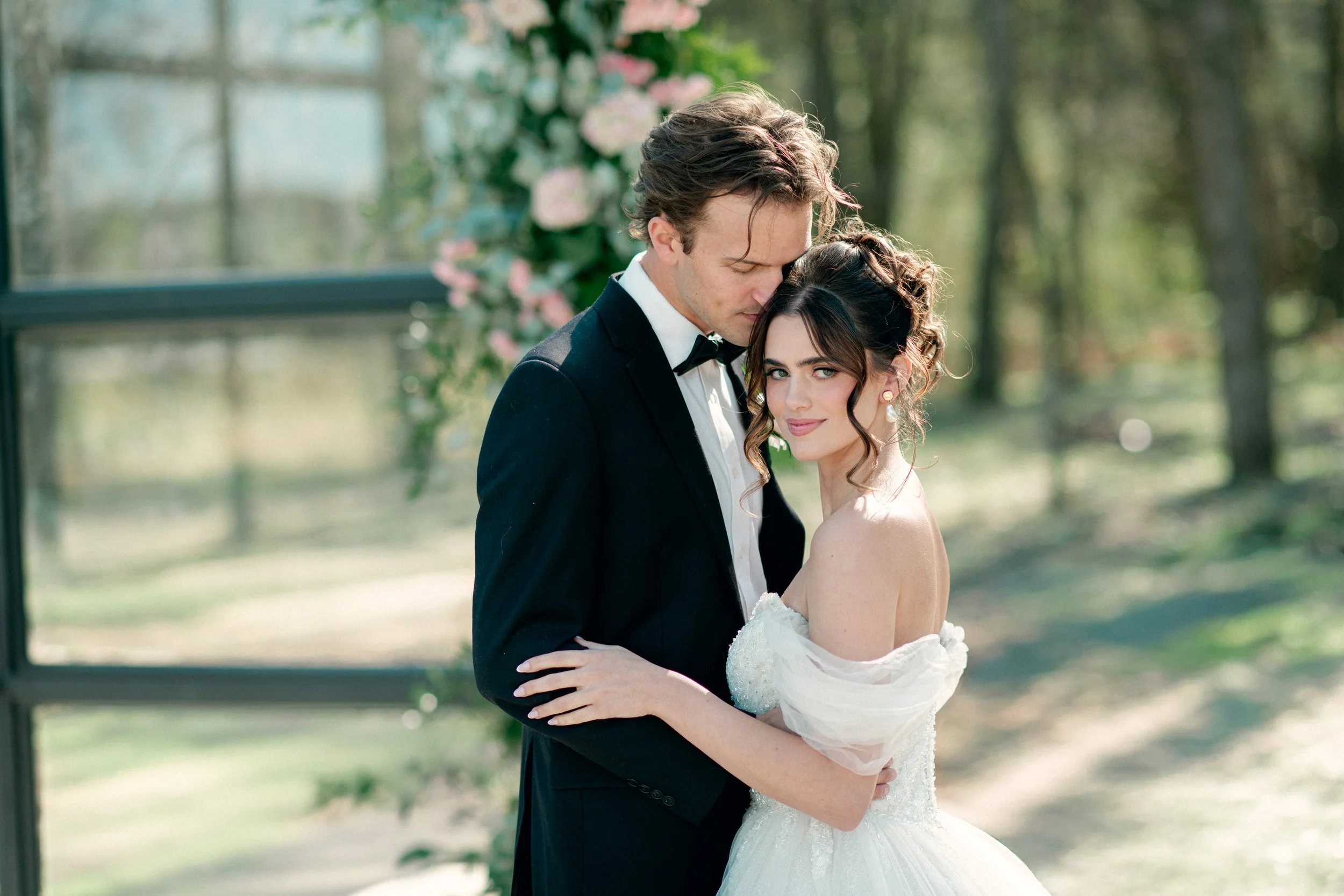 Editorial wedding photos inside the Glass Chapel at Jubilee Woods with natural light and modern architecture