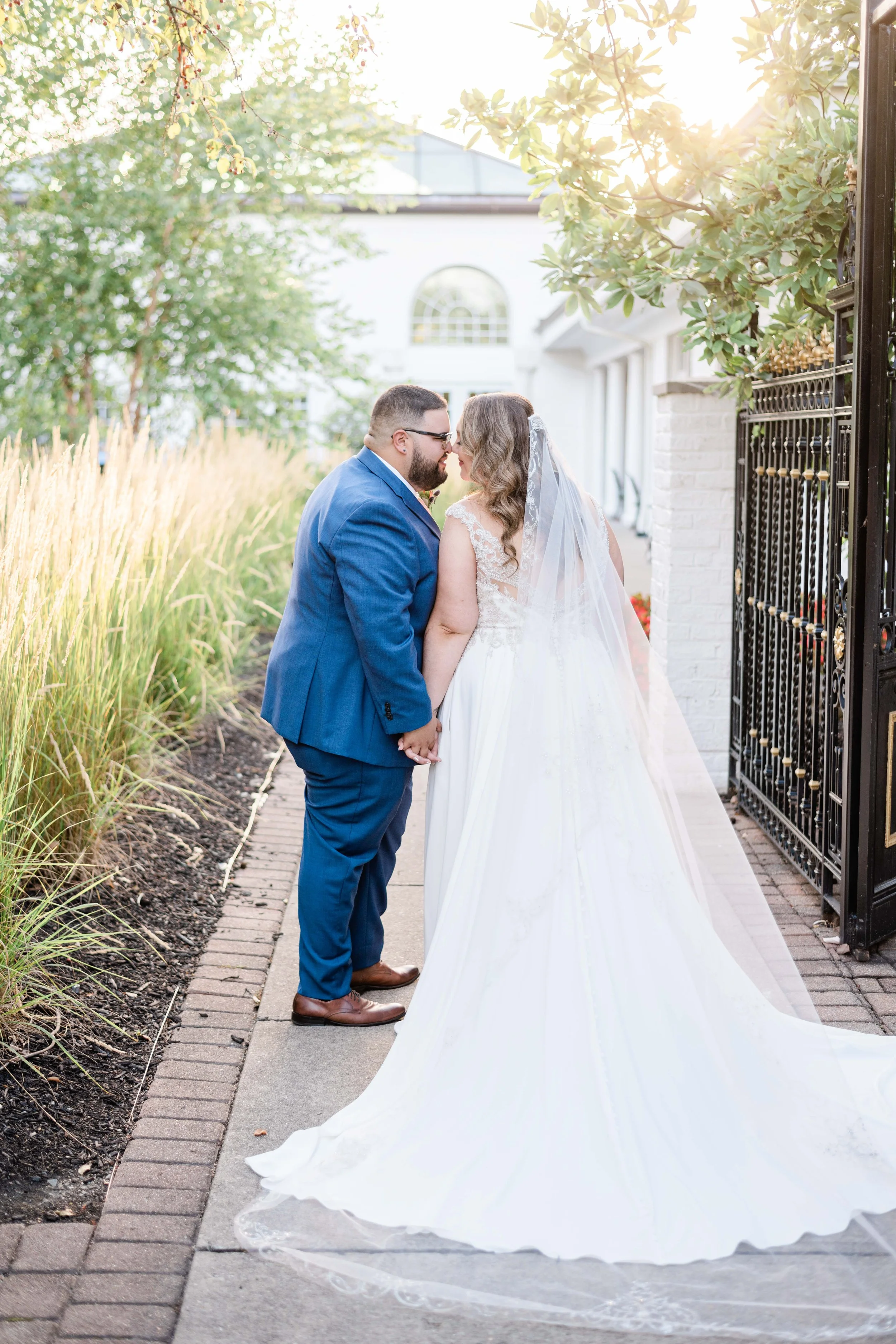Portrait of bride and groom on their wedding day at The Manor House during golden hour