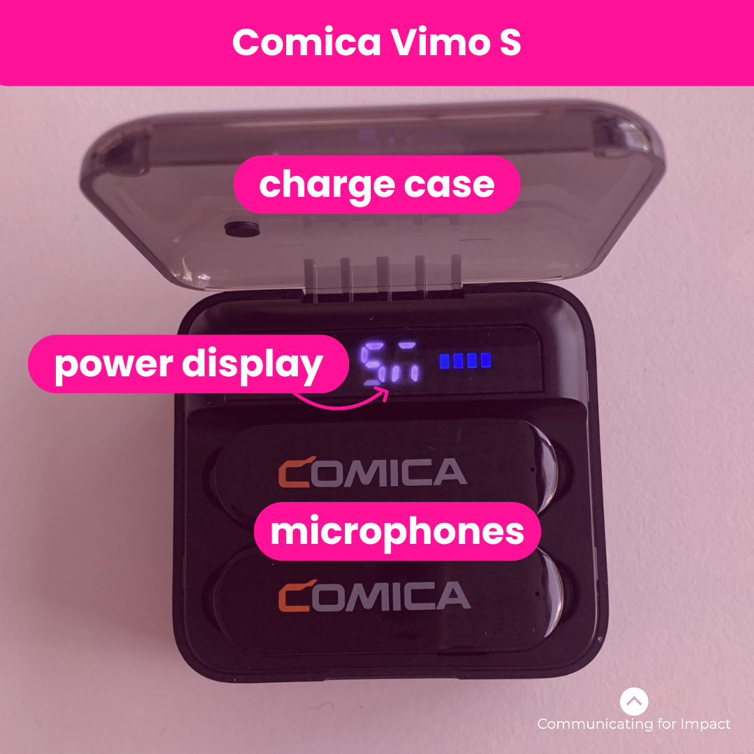 An overhead photo of the Comica Vimo S mobile microphone. The photo shows the charge case cover open, the battery percentage and the two microphone within the charge case.