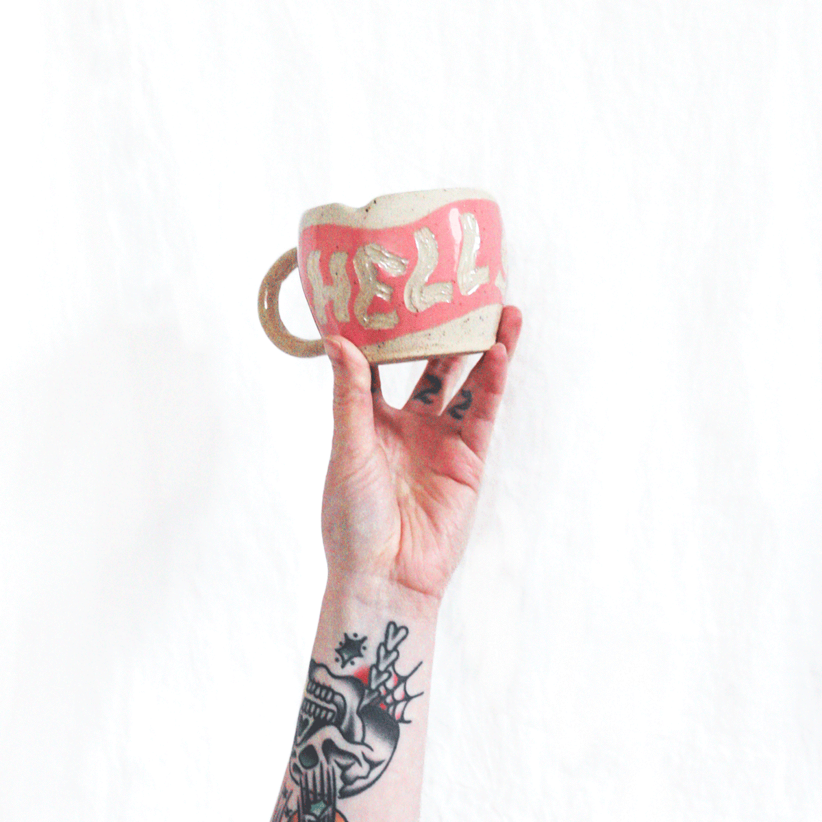 Rachael-Renae-Handcrafted-Pink-Red-Hell-Yeah-Ceramic-Mug-in-hand.gif