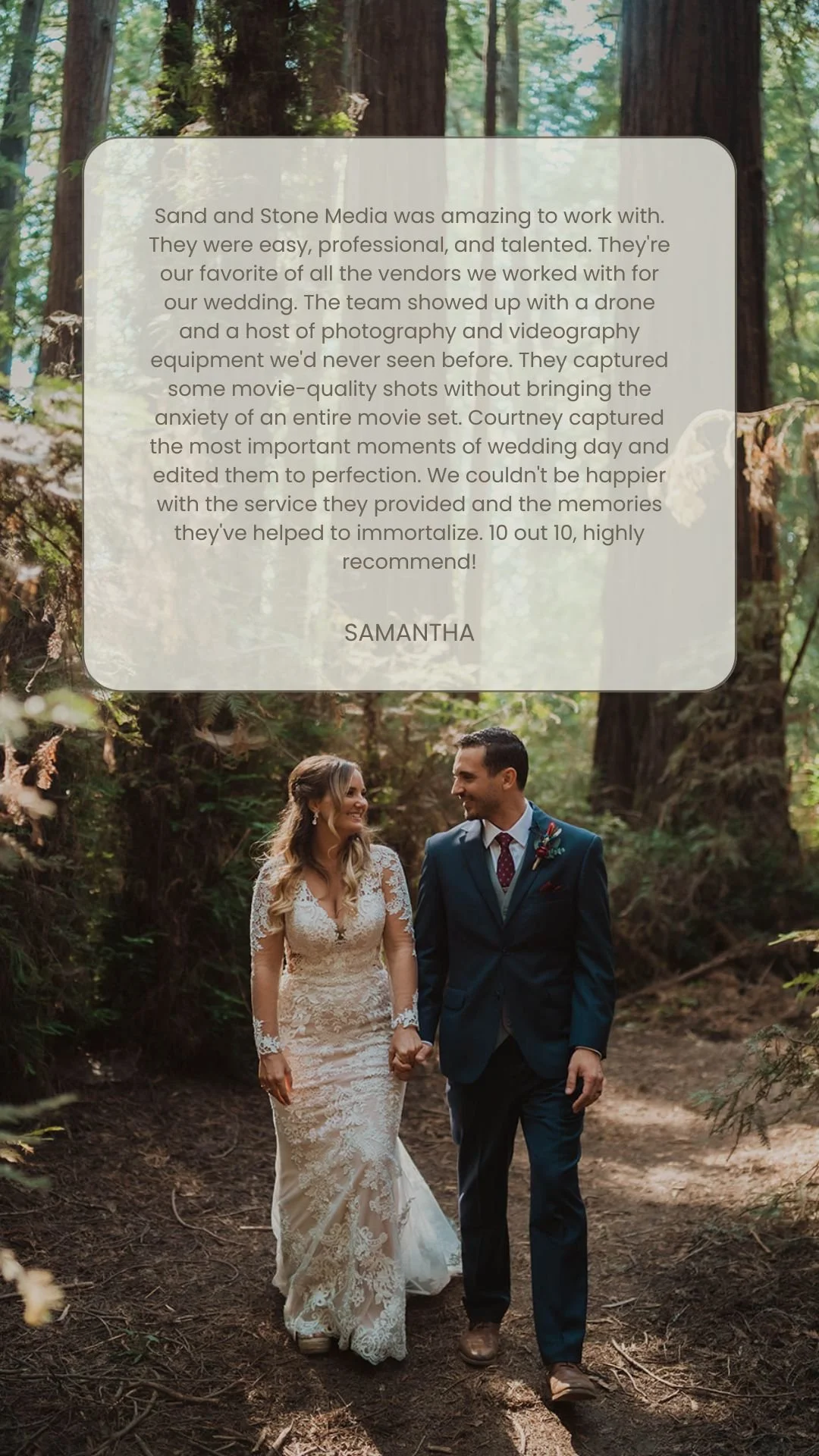 Couple in wedding attire walking hand-in-hand through a forest, surrounded by tall trees and greenery.