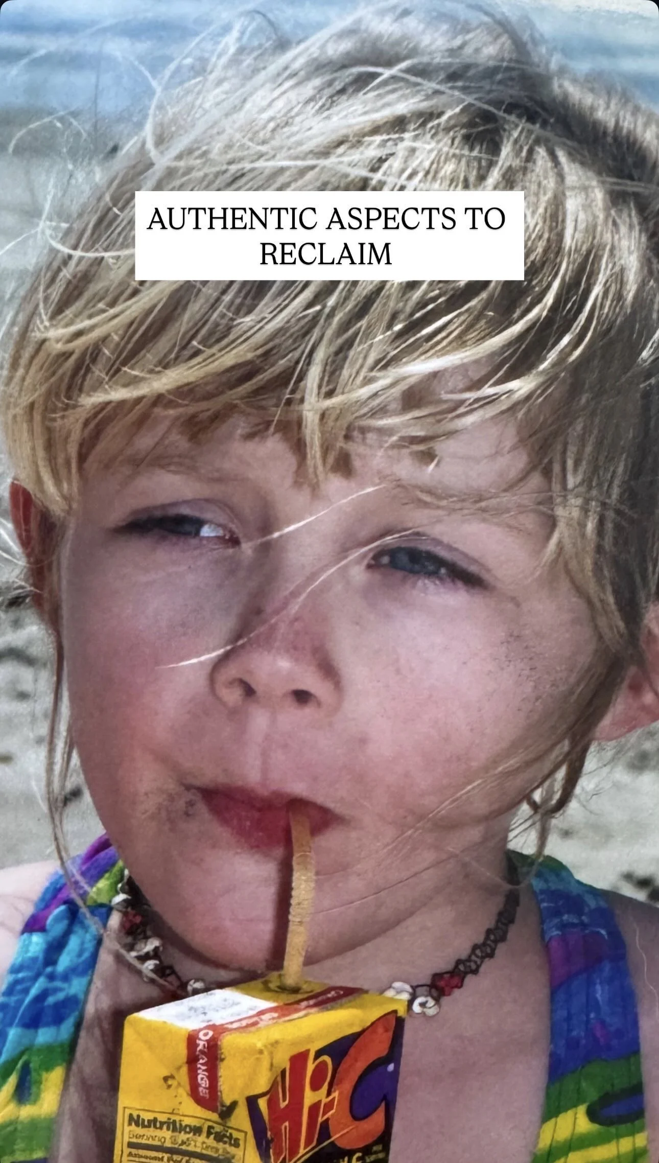 A young girl with blonde hair drinking from a juice box through a straw on a beach, with the caption 'Authentic aspects to reclaim'