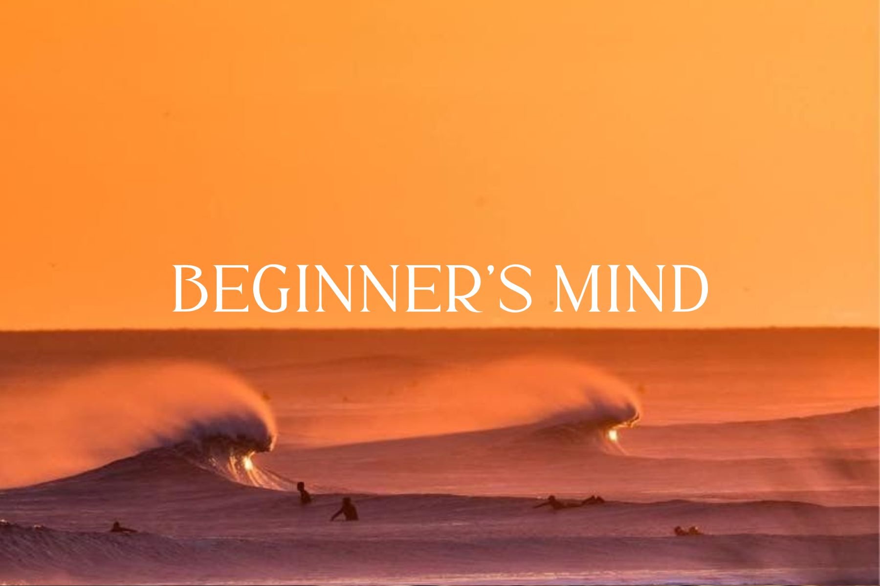 Sunset over the ocean with waves and surfers in silhouette, and the text 'Beginner's Mind' overlayed.