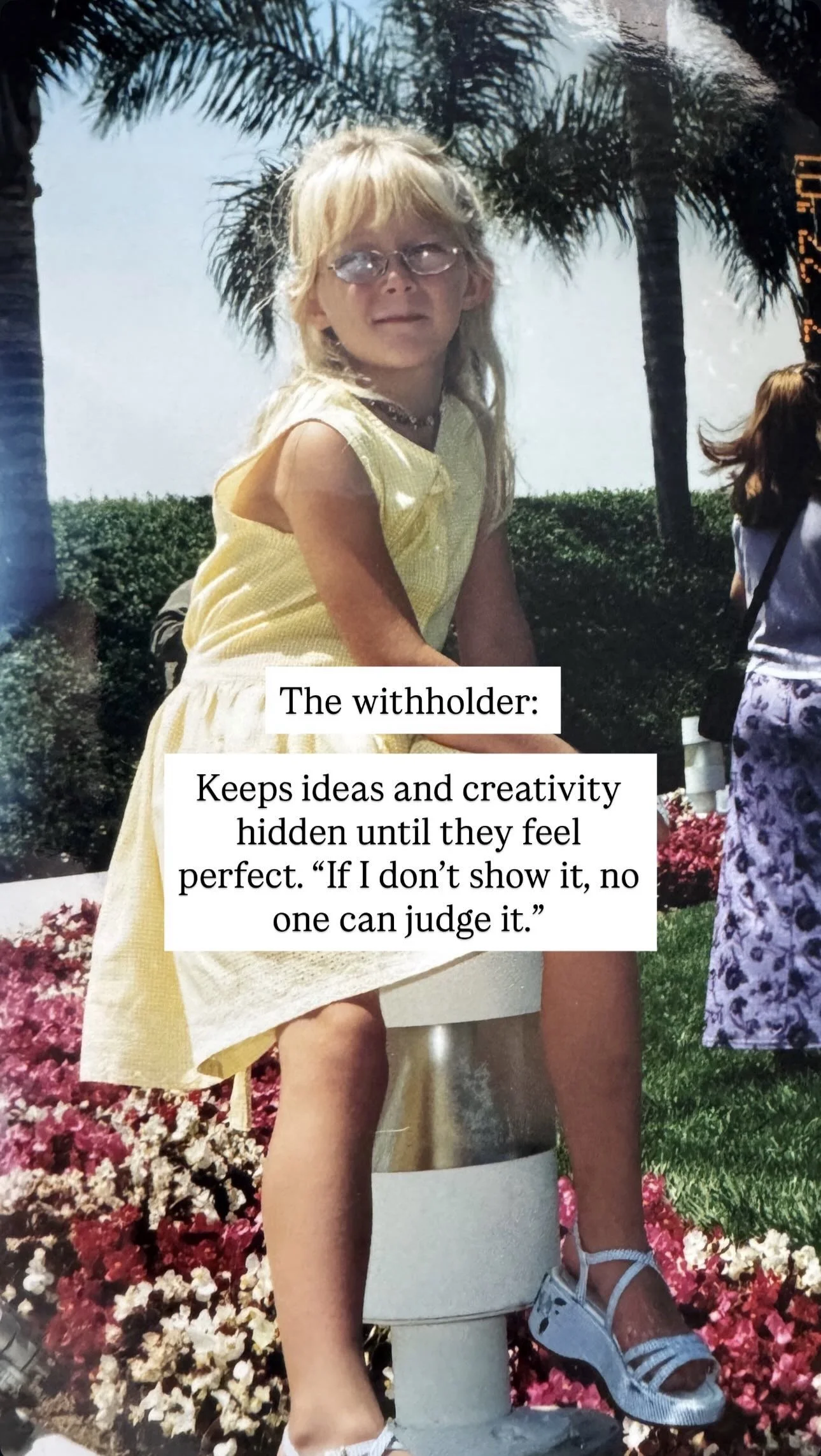A young girl with blonde hair and glasses sitting on a small pedestal outdoors with palm trees and flowers in the background. She is wearing a yellow dress and white sandals. There is a quote on the image about a 'withholder'.