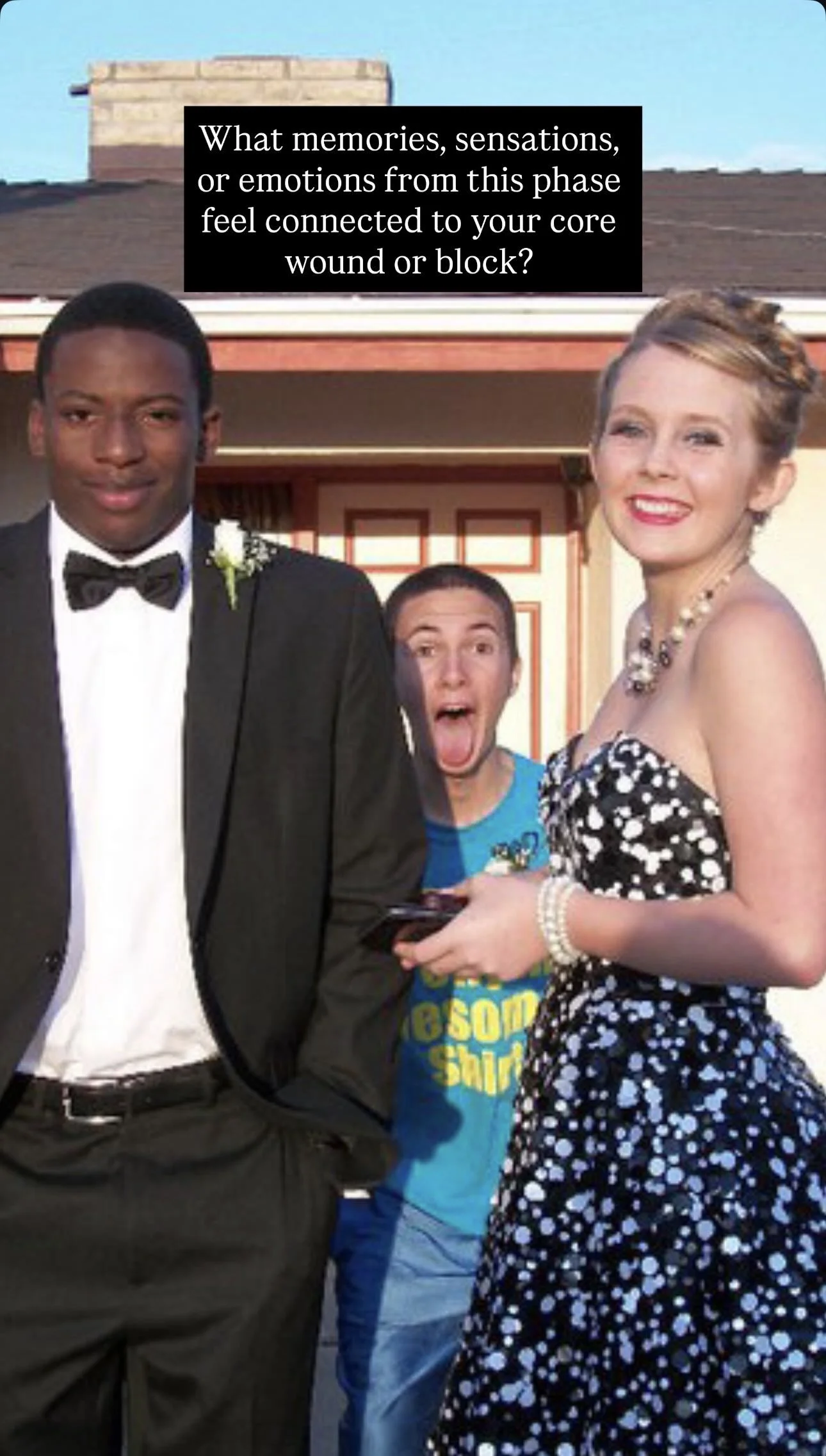 Three people standing outside a house, a man in a tuxedo, a woman in a black and white dress, and a boy in a blue T-shirt with a surprised expression.