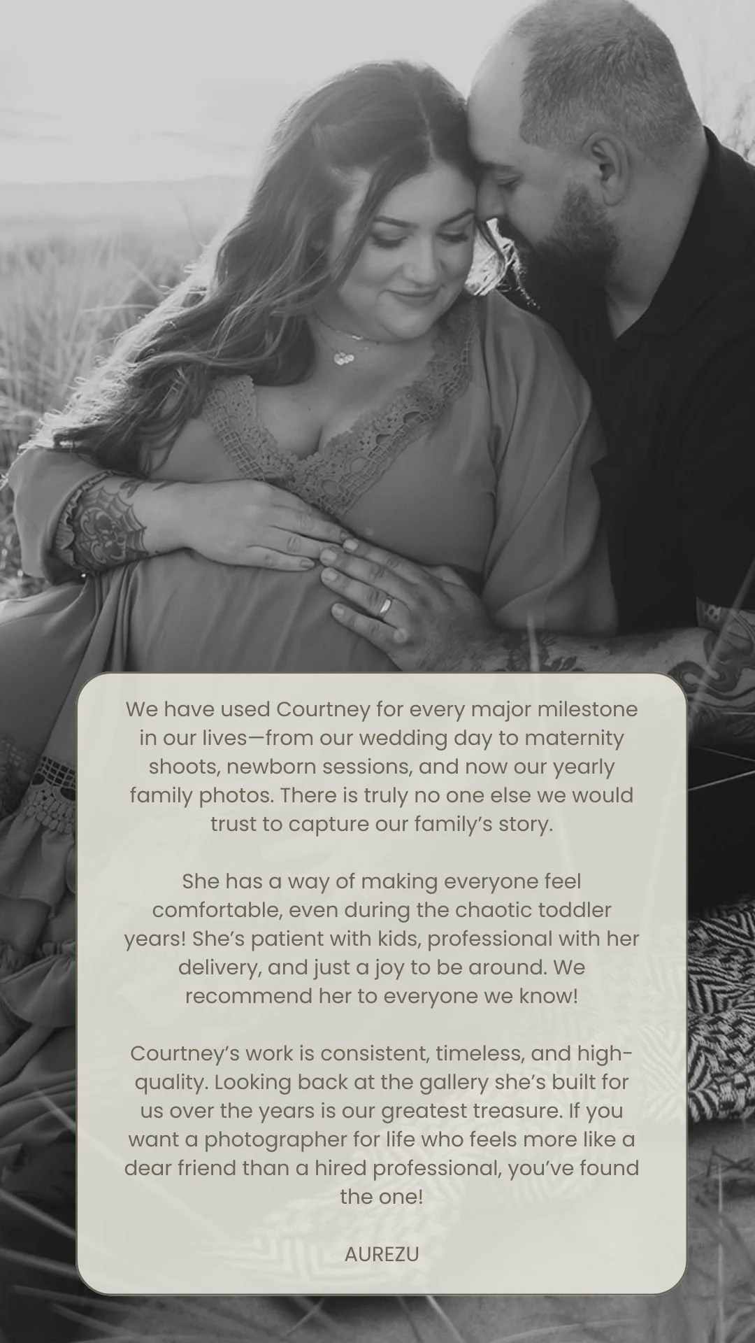 Black and white photo of a couple, with the woman pregnant, sitting outdoors in a field. The woman is smiling with her eyes closed, and the man is resting his forehead against her head. There is a speech bubble with a message praising the photographer, Courtney, for their milestone family photos.