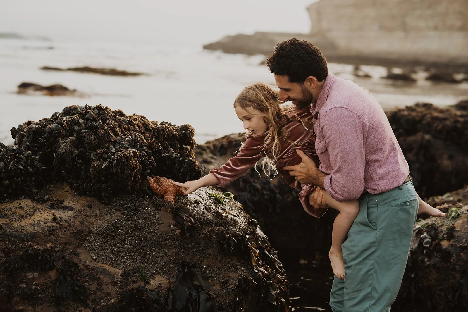 Sunset family photoshoot exploring the tide pools at four mile beach