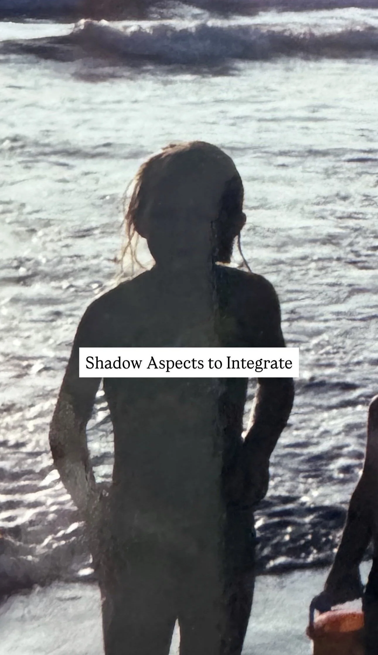 Silhouette of a person standing on a beach near the water with the text 'Shadow Aspects to Integrate' overlayed.