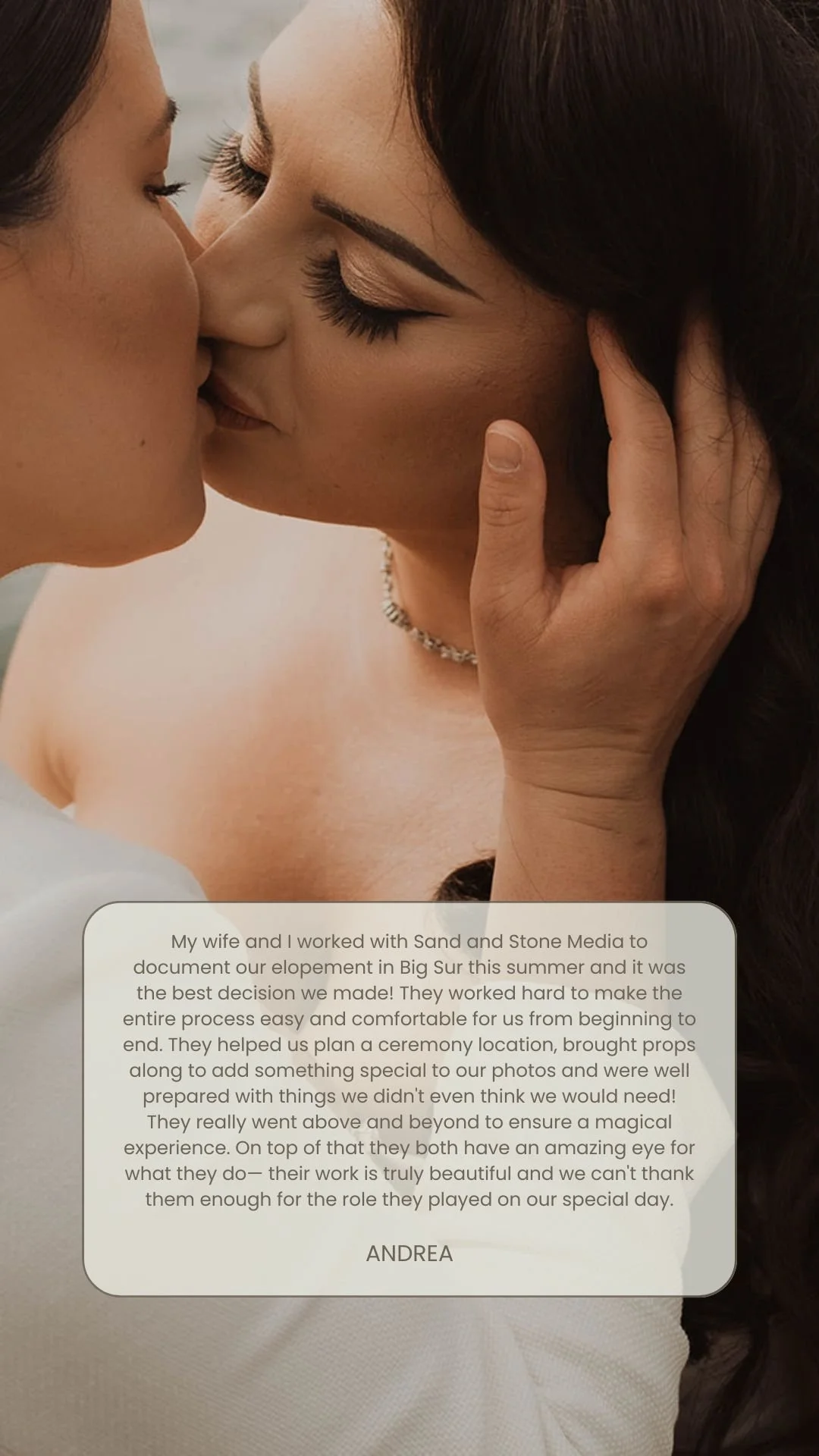 Close-up of a couple kissing, with a woman holding the man's face gently. The woman has dark hair styled in waves, makeup, and a necklace. The man has light skin and short hair.