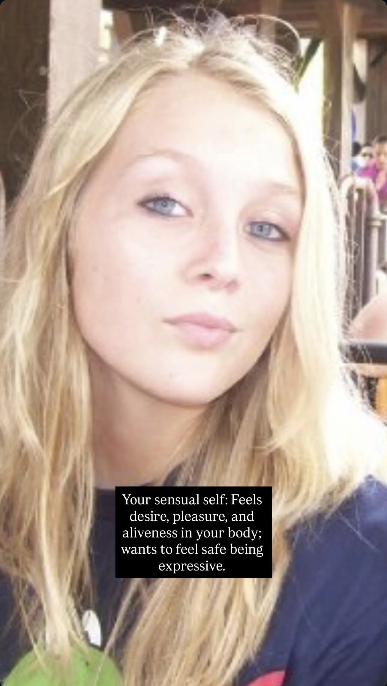 A young woman with long blonde hair and blue eyes is sitting in a bright, rustic setting. She has a calm expression on her face and is wearing sunglasses on her head. There is a text overlay that reads: "Your sensual self: Feels desire, pleasure, and